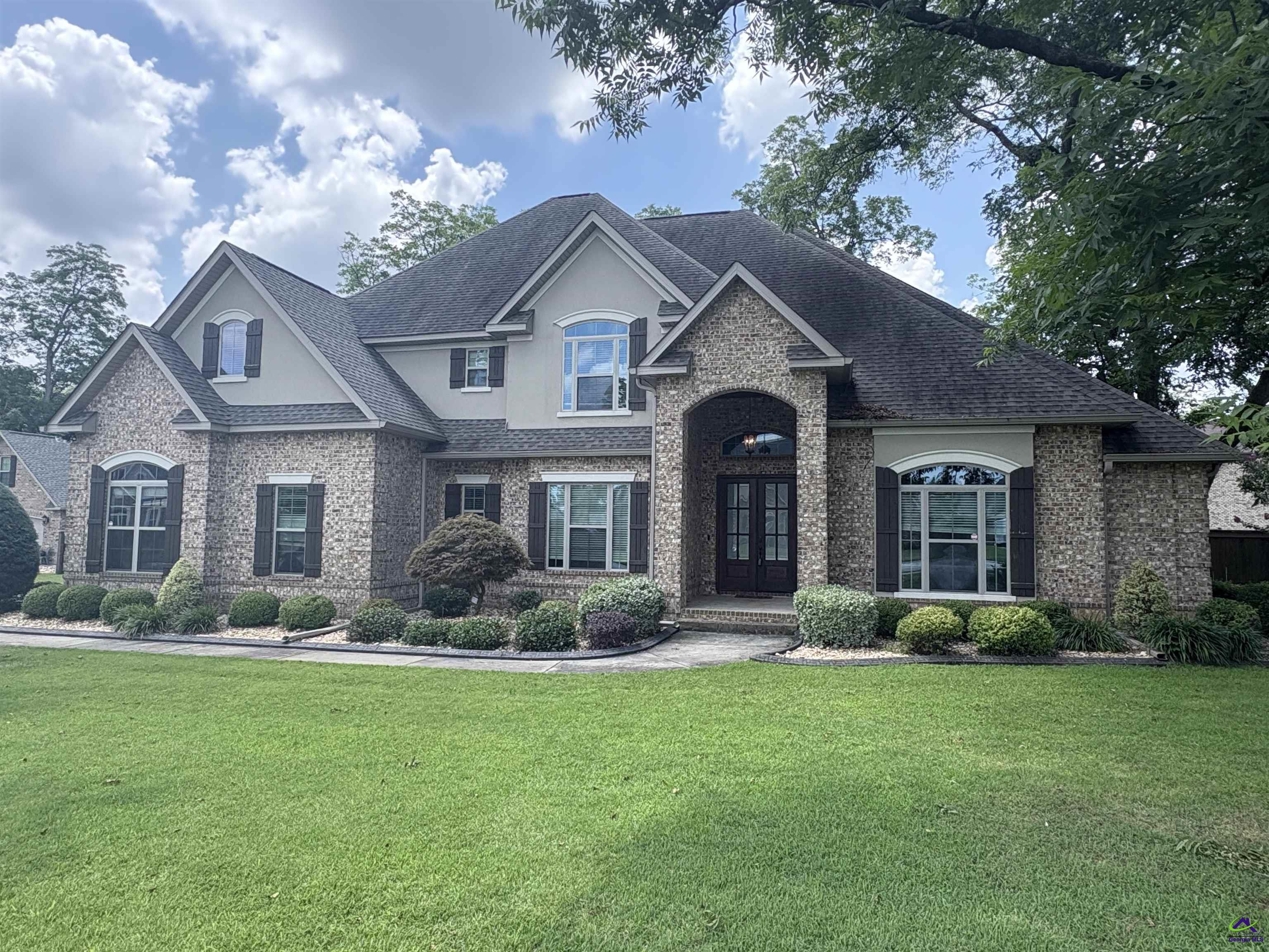 Spacious 6BR/4.5BA brick home offers almost 4,200 square feet of living space. The main floor features a great room, separate living room, open kitchen and breakfast area, a formal dining room, custom Master suite, and a second bedroom with full bath that could also serve as a home office. The second floor features 4 additional bedrooms, 2 full bathrooms, and additional spaces for storage or other uses. Exterior features include a privacy fence, a large screened porch and a separate patio perfect for summertime entertainment. Sited on an almost half-acre lot. Rental requirements include, but not limited to, a minimum 625 credit score, 3x the monthly rent for gross monthly income, and a clean, verifiable 2-year rental history.