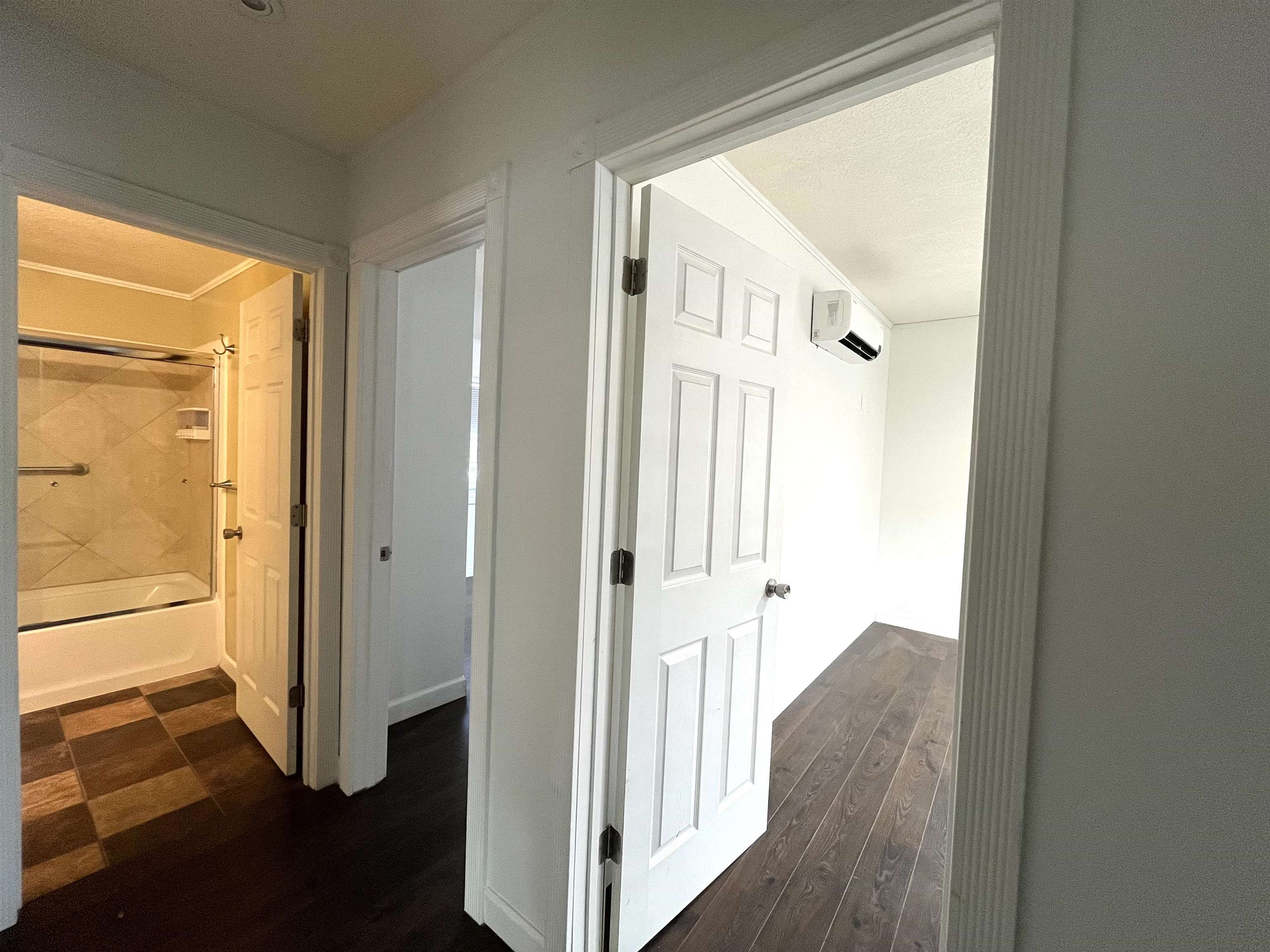 hallway to bath and 2 bedrooms