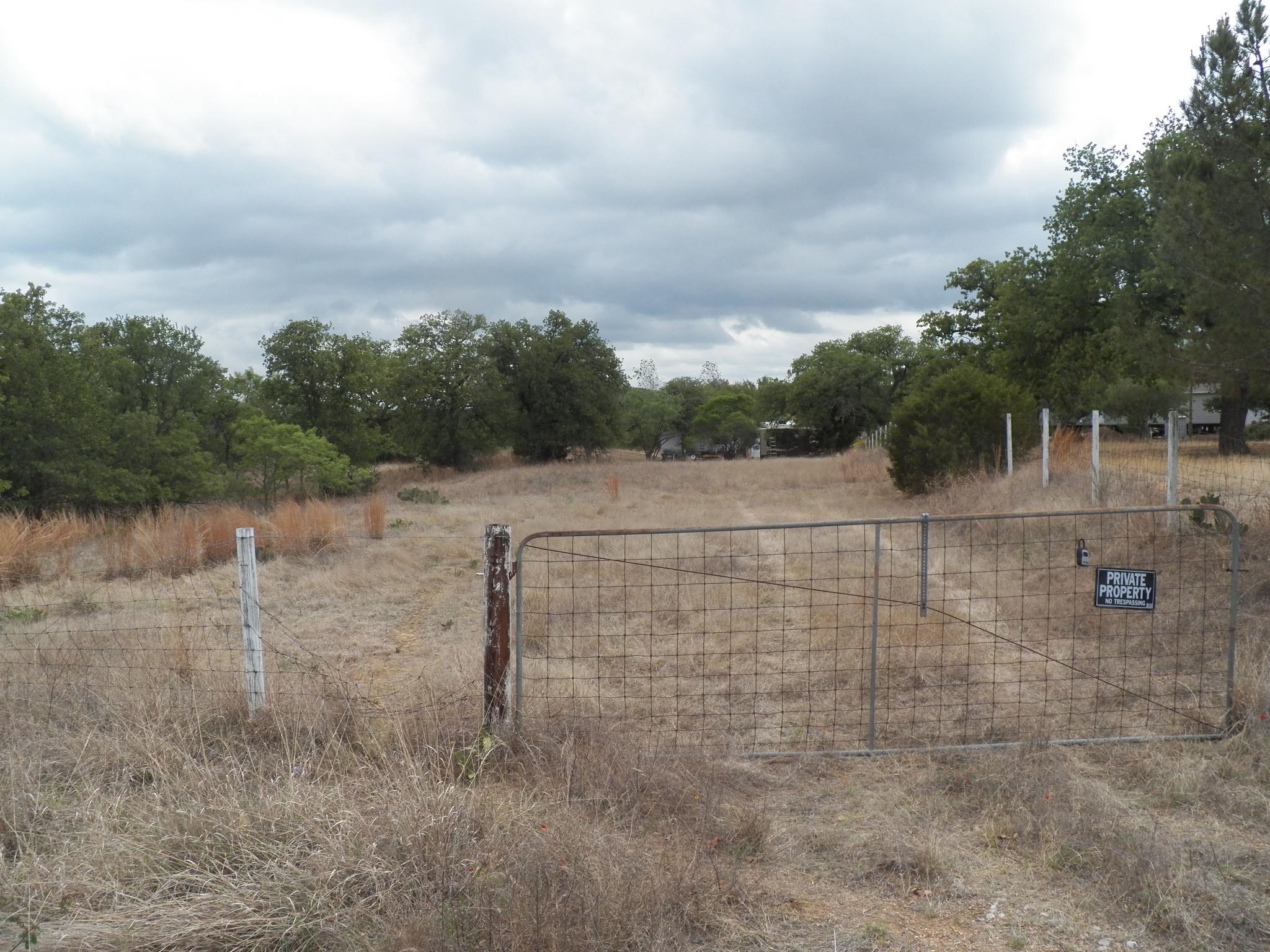 partially flat lot in good area. Plenty of room to build on the flat part of lot. Has wet weather creek on one side.