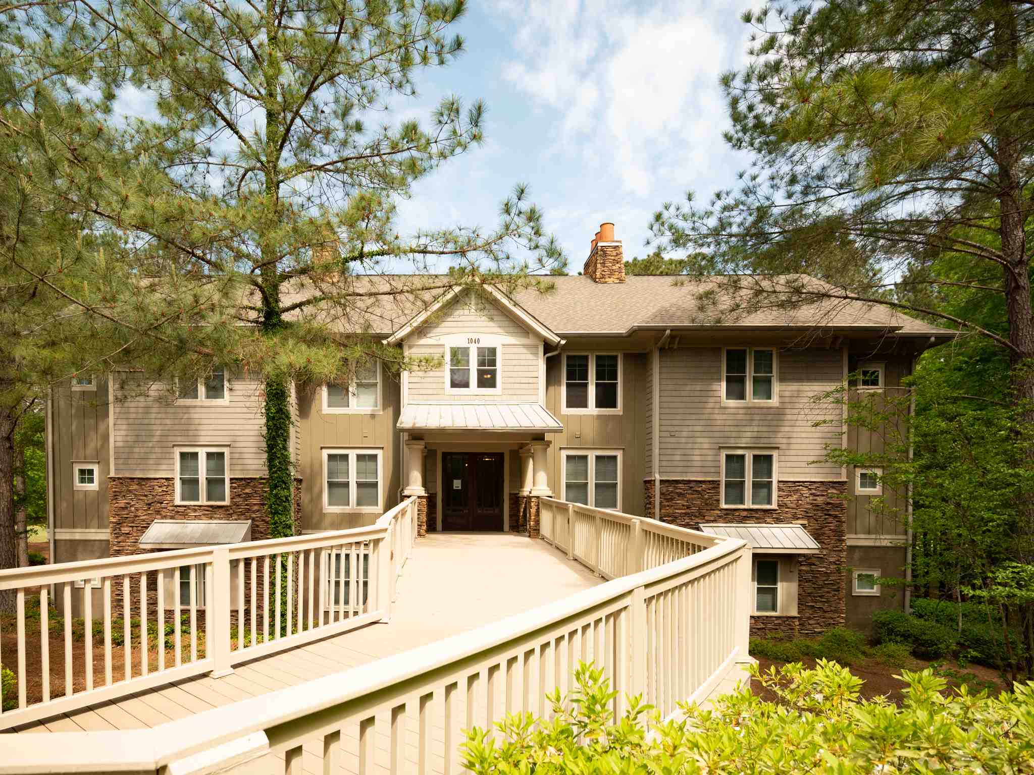 Great condo located on the 16th hole of the Oconee Course, designed by Rees Jones. The terrace level, covered patio overlooks the beautiful water feature and golf view.  Master suite offers spacious walk-in closet, private access to covered patio and bath with separate shower and soaking bathtub. The great room features a fireplace with gas logs, built-in cabinetry, and large windows framing the golf course. The dining area has access to terrace level covered patio. Kitchen boasts granite countertops and raised breakfast bar. Guest room has convenient access to full hall bath. There is a detached single-bay garage with storage. Seller makes a Club membership available for Buyer to learn more about how they can enjoy six carefully crafted golf courses, a unique sporting ground, tennis, fitness, and all the recreational and culinary amenities befitting a world-class private club.
