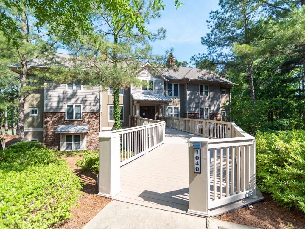 Enjoy lock and leave convenience with this well-appointed updated walk-in level condo in the Village at Lake Club Pointe. Conveniently located just across from the Lake Club pool, fitness and tennis facility and a short walk from the Lake Club marina. Gorgeous views of hole #16 on The Oconee course as well as the adjacent creek and water feature. Lovely dining area and breakfast bar in kitchen. Stainless steel appliances, quartz countertops. Wood floors throughout. Covered porch. Spacious closets, jetted tub, and beautiful ensuite in master bedroom. Detached single car garage. Seller makes a Club membership available for Buyer to learn more about how they can enjoy six carefully crafted golf courses, a unique sporting ground, tennis, fitness, and all the recreational and culinary amenities befitting a world-class private club.