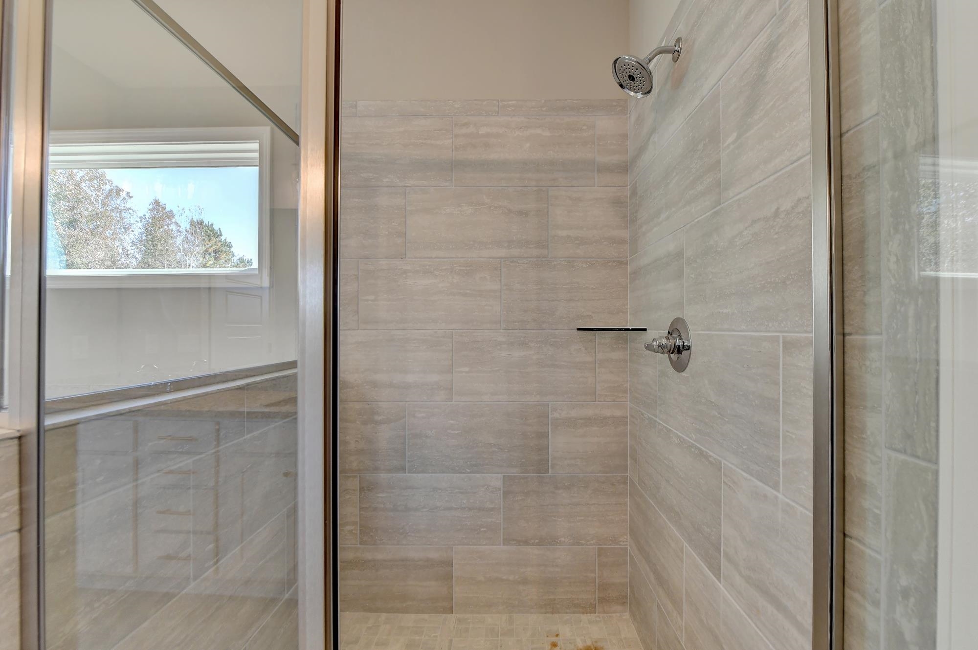 Master Bathroom with separate shower and tub and dual vanity