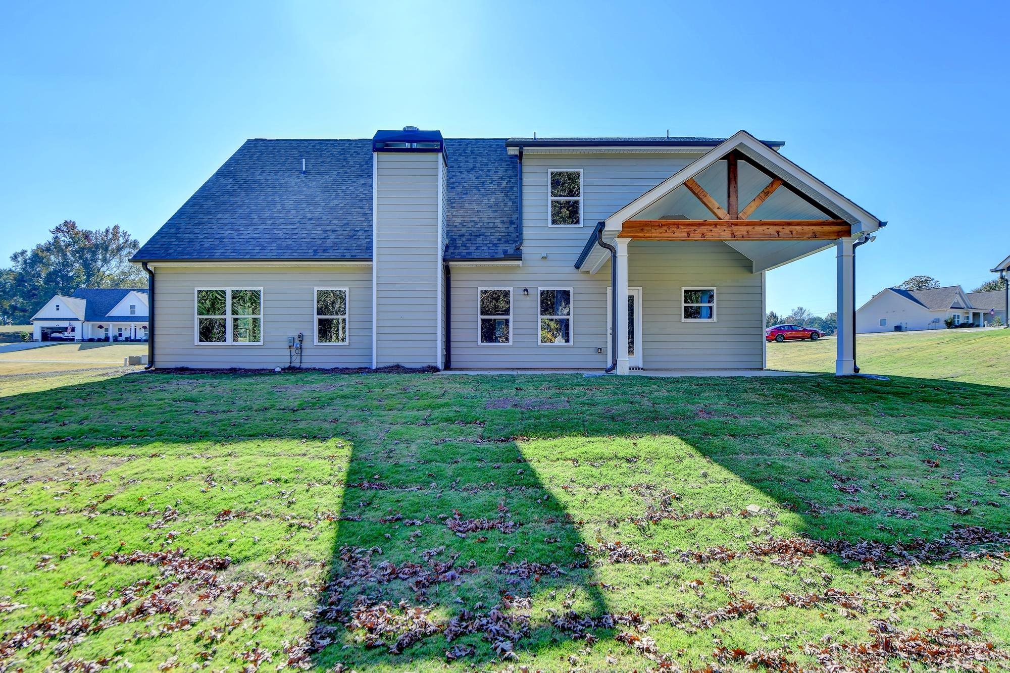 Rear of home and view of covered porch