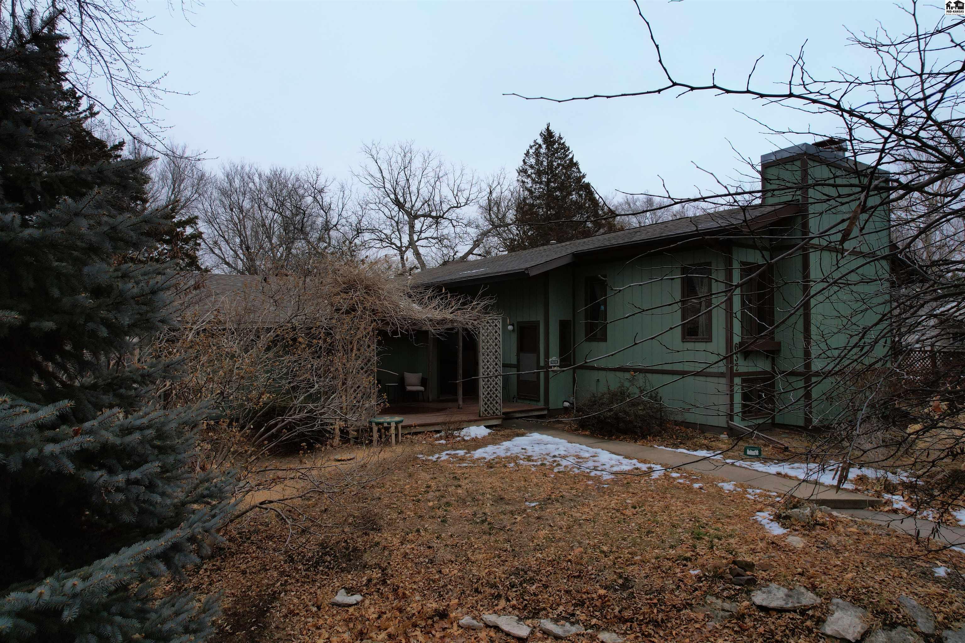 Here is the Lindsborg home you have been looking for!! Rarely does the opportunity to own an iconic Lindsborg Hoag designed and built home come along! Sitting on a stunning .67-acre lot near Swensson Park and Bethany College this split-level home offers 4+ bedrooms and 3 bathrooms. Featuring vaulted ceilings and open concept floor plan with glorious light streaming through the generous windows, you will feel one with your surroundings.  With 3 bedrooms and 2 bath on the main floor, this home also offers a full basement with additional family gathering space and plenty of windows that provide light like a main floor! Basement also has 1+ additional bedrooms, 1 bathroom and generous laundry and utility room. With abundant storage this home is perfect for those needing space to spread out!  No more cramming your belongings in tiny closets, the large master en suite features a walk in closet and private bathroom!  Enjoy time spent relaxing in the main floor screened in porch positioned just off the kitchen and dining.  So much to love with this lovely Lindsborg home!!! Schedule your personal viewing today, before this stunning home is gone!