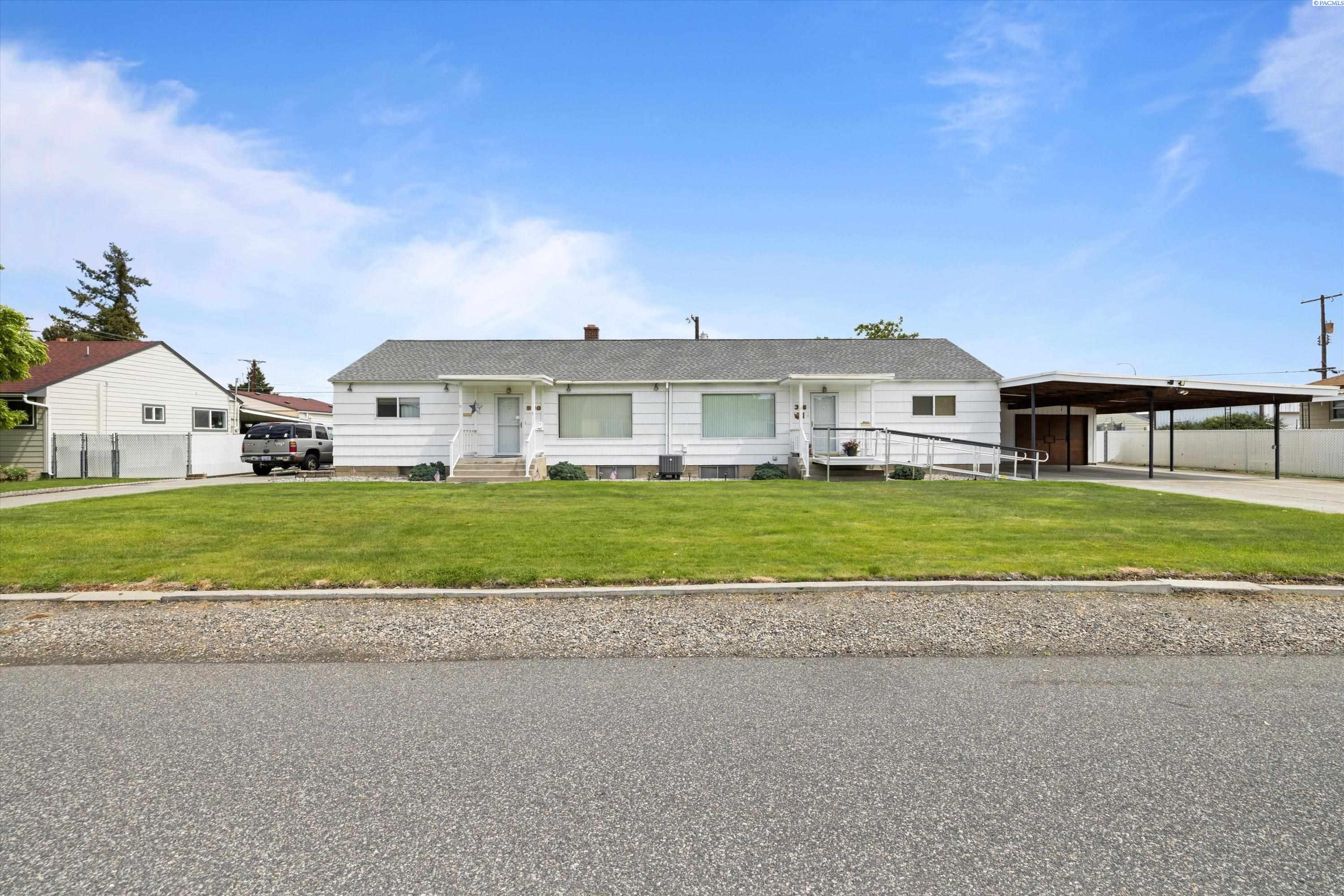 MLS# 275761 Opportunity Knocks! This B duplex features a prime location in Central Richland, providing easy access to amenities including shopping centers, restaurants, entertainment venues, parks, and more. Enjoy the convenience of living near everything you need. Lots of updates/improvements, including new heat pumps in each unit. In unit 318 both bathrooms have been updated.  All new vinyl windows on the entire duplex. Unit 318 offers 3 bedrooms 2 bathrooms.  On the second level you can enjoy a huge family room with fireplace & one bedroom and laundry room, plus extra storage. Unit 320 offers 2 bedrooms 1 bath plus the lower-level family room, and laundry room.  Each unit its fenced for privacy.  Unit 318 offers lots off street parking, carport and detached garage. The garage has several cabinets and shelving to store all your tools.  Each unit has covered patios for those hot summer days.  Unit 320 also offers off street packing. The property has UGS sprinkler system. This Duplex presents an excellent investment opportunity, with excellent cash flow. Take advantage of Richland's thriving rental market and secure a sound financial future. Don't miss your chance to own this fantastic duplex. Contact your agent for a private tour!
