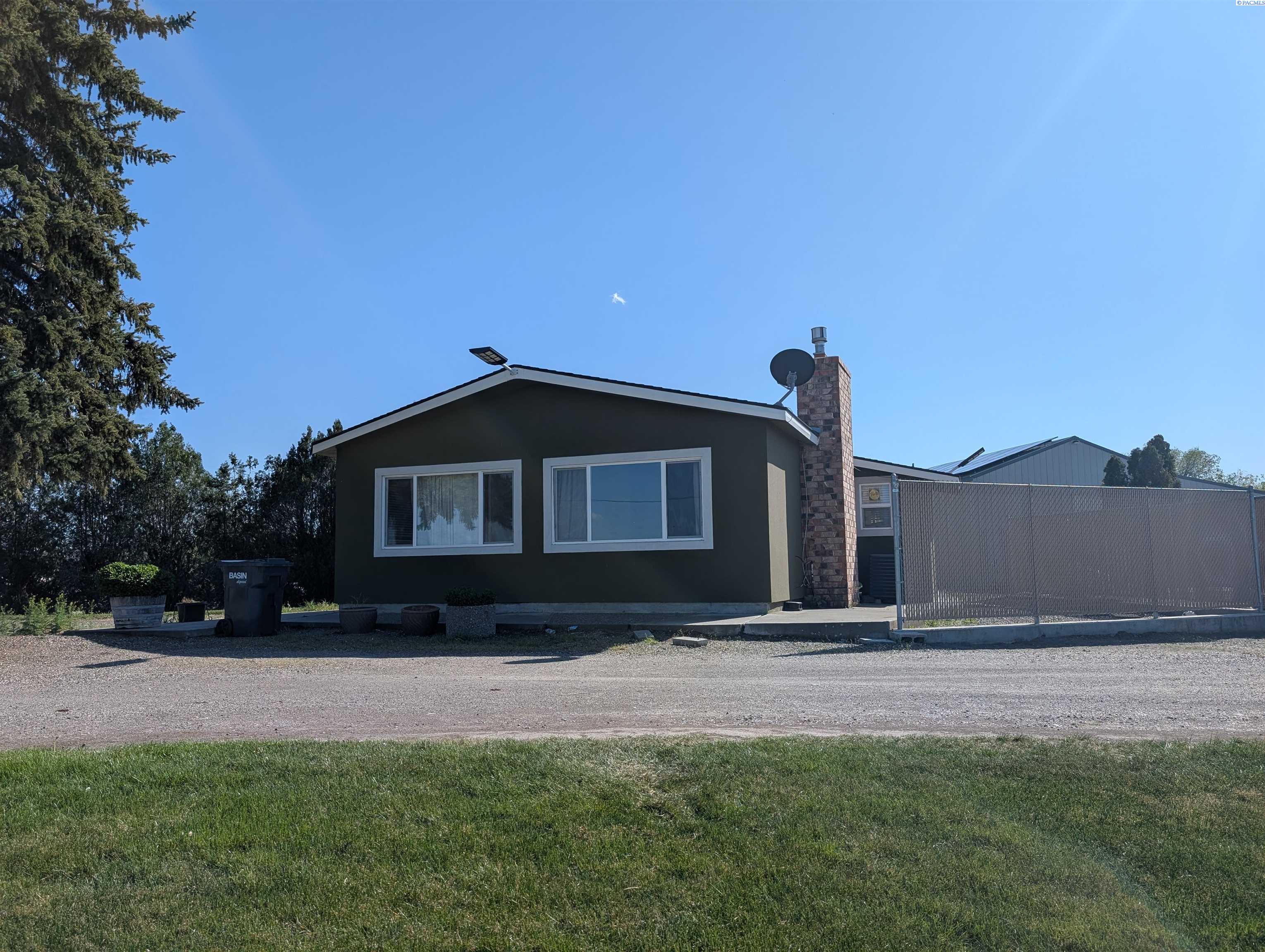 MLS# 283484 Your opportunity to get this recently remodeled, interior and exterior, mftrd 3brm/2bth home. Sale includes home plus a huge sprayed -foam insulated shop with an extra bedroom and full bath inside. 2 subdivided lots: lot 1 with 1.15 acre and Lot 2 with 1.14 acres each  with its own well. Exterior of home was totally re-stuccoed less than 2 years ago and interior was totally remodeled and updated with quartz counter tops and laminated plank floors. The fire place allows you to enjoy the cool nights while viewing the cultivated fields below.  New owner will never have to worry about power bills as home is equipped with a large BRAND-NEW system of OWNED solar panels to power home all year round.NOTE:PROPERTY CAN BE SOLD SEPARATELY: 1. IF ONLY ONE BUYER FOR ENTIRE PROPERTY, LISTED PRICE APPLIES; 2.. IF TWO SEPARATE BUYERS, THE   LOT #1, 1.15 WITH THE HOME, SOLAR PANER SYSTEM,  AND  THE SHOP FOR 350K AND LOT #2, 1.14 ACRS WITH WELL FOR 210K. CAVEAT: CLOSING FOR BOTH BUYERS SHOULD BE THE SAME DAY, SAME TITLE CO.