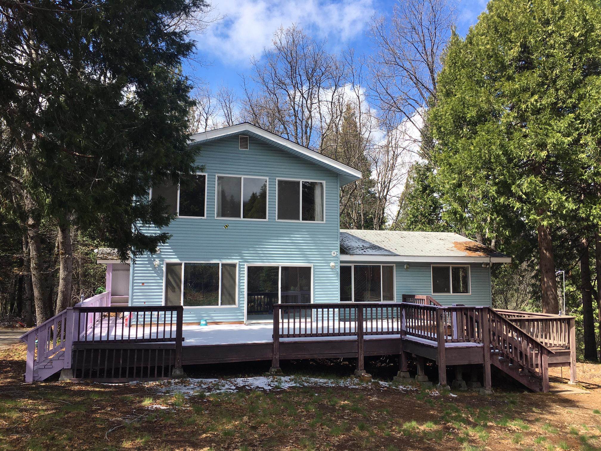 This hard-to-find 5BR/3BA home has a wonderful view of Mt Shasta!  At well over 3000 sq.ft. total living space, and 2.25 acres in one of Mt Shasta's sought-after neighborhoods, you don't need to look any further.  This home is set up with two master bedrooms, one in the lower level and one in the upper level.  Upstairs master features a beautifully remodeled bathroom with a newer vanity, tile floors, and a jetted tub.  Other bathrooms also feature tile floors and newer vanities.  Living room, entry and hallway feature wood flooring.  The roomy kitchen has plenty of room for a large dining table, oak cabinets and a view of the front yard.  Good sized deck lets you enjoy the peaceful setting. Vinyl siding ensures you'll spend your time having fun instead of painting every few years.  Blacktop driveway and parking area provide plenty of room for vehicles to turn around, while still providing room for your RV or a car-port or detached garage.
