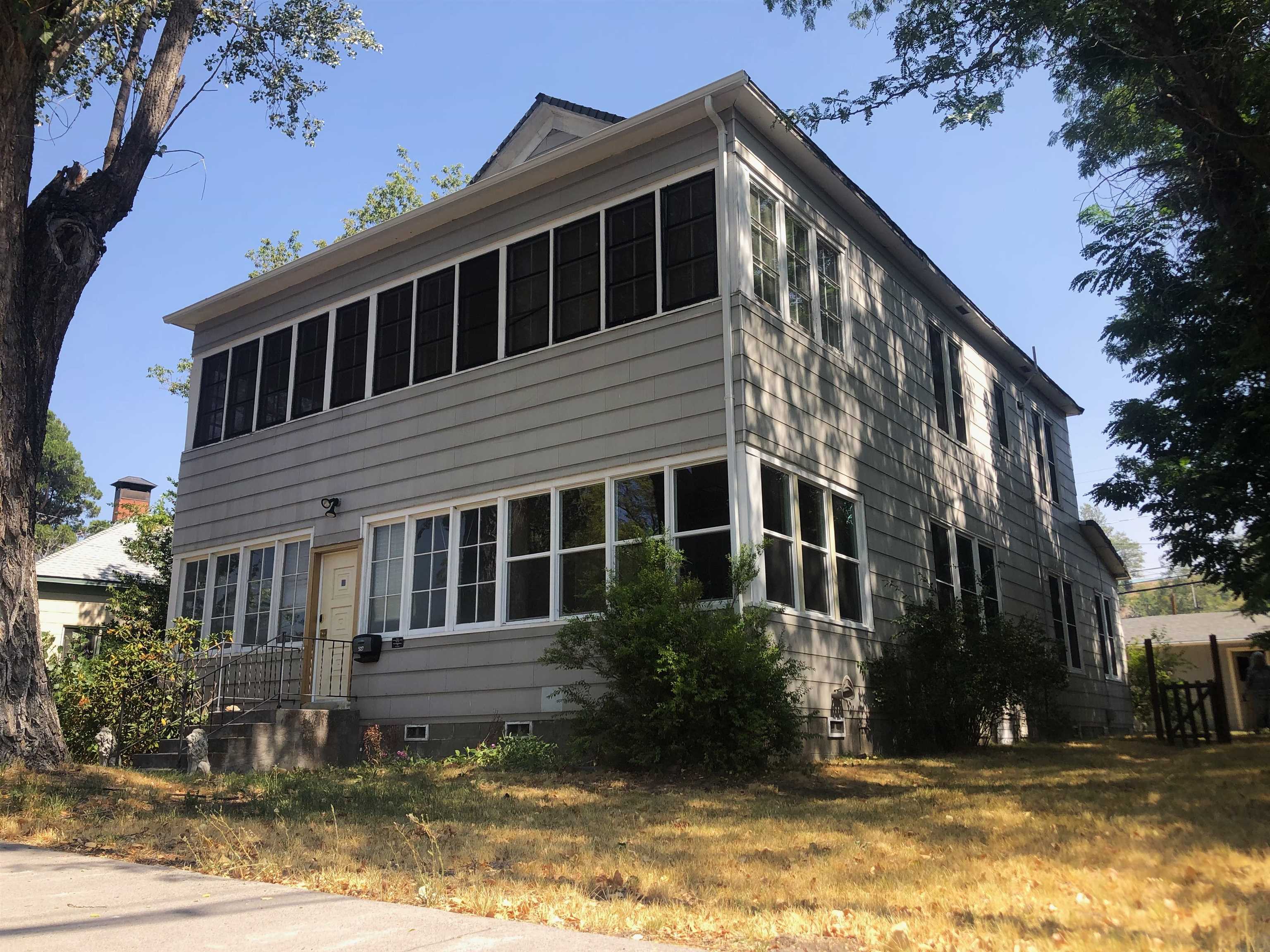 Magnificent historic house in the center of downtown weed, CA.  The original home and office of the first Doctor in town, it was built to impeccable standards in 1913, during the height of the lumber boom. There are 10' ceilings, views of Mt Shasta from half the bedrooms, and well preserved Edwardian touches throughout, as well as a detached garaged/workshop in the back. While maintaining the incredible heritage, many updates have been accomplished under the current ownership, including brand new windows throughout. The property qualifies for both residential and business zoning, and currently holds a license for short-term rental usage. Come experience the best of the past in your present, set up a showing today!