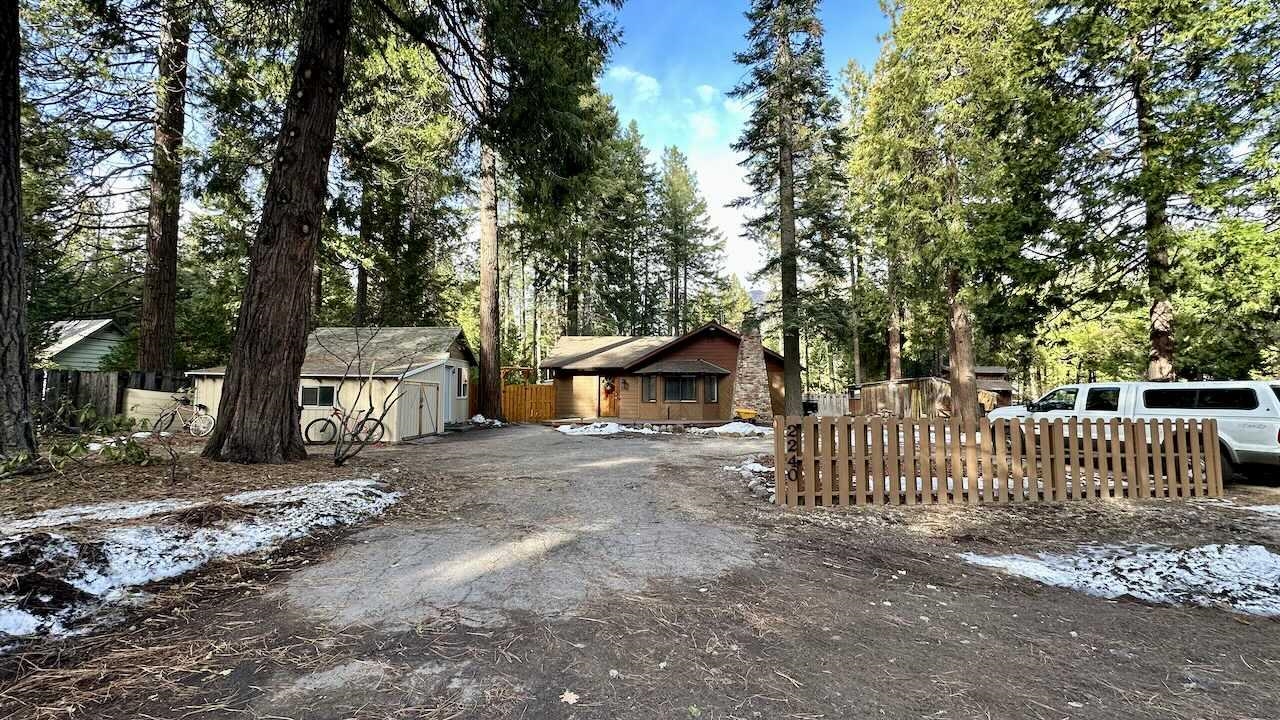 Charming cabin style home located minutes from downtown Mt Shasta. Home is a single level, split floor-plan, three bedrooms and one bathroom with a tub/shower combo. Home has a huge pantry room, cozy warm fireplace insert in living room with large mantle. New trex deck at the front entrance, a slider door exits the primary bedroom to a fenced and gated back yard with room for gardens and fur-babies. There is a small horse coral, shelter / wood shed and outbuilding. The one car garage is used for storage, it has a new roof and siding and was at one time a smaller cottage.
