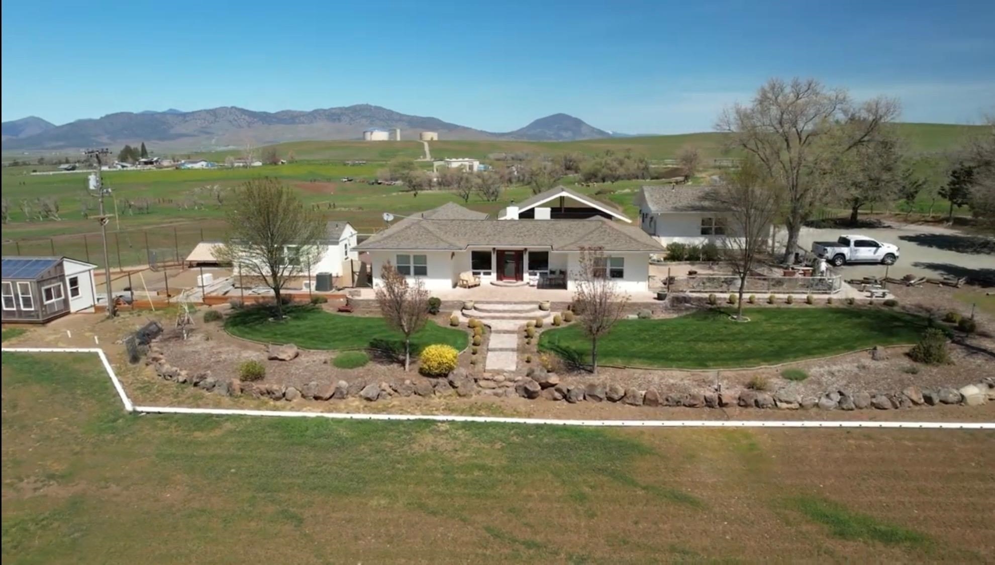 The owners have invested 1.3 million into this completely remodeled and updated Mt. Shasta view home! The main house has 2,300 sf, 3 beds, 2 baths, and a lovely custom kitchen with hickory cabinets, granite countertops, and large island w/ prep sink. The master suite features vaulted alder ceilings, double closets, tile & double sinks in the bathroom, and the 3rd bedroom currently converted into & used as an open office.   The home has a great outdoor kitchen, a large covered patio, jacuzzi, and solar-heated pool - fantastic for entertaining! There is a recently built 336 sf guest house with a full bath, kitchenette, and mini split heat and air for additional living space or possible extra income.  A 4-stall metal barn (40x30) & large dog kennel, both with water & electricity, are ready for animals.  The 16'x16' hobby shed/greenhouse features an evap cooler, power, water, & propane to the building.  There's a fully insulated garage with a 1/2 bath & hot water. The property is fenced & cross-fenced with gently rolling terrain and 8" gated irrigation pipe across the pasture. Located just down the street from the Shasta Valley Wildlife Refuge, for riding & waterfowl hunting galore!