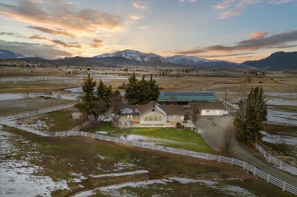 Absolutely stunning once in a lifetime Ranch opportunity in Siskiyou county, CA. features an immaculate 4bed/3bath custom built 3500 sqft home with spacious living situation. Could be ideal for entertaining or a family home with room to grow!  This equine lovers dream ranch home features tall knotty pine ceiling leading to a wall full of windows that catch the stunning Mt Shasta views. Upscale features include rough edged tile counters in the kitchen, stainless steel appliances, custom tile walk in showers, large bedrooms, primary suite with doors that open to the landscaped yard, outdoor kitchen and a perfect spot for the spa. This entire 20 acre estate is surrounded by mountain backdrops, includes a detached garage turned into a workshop and bonus room with a carport, 2 beautiful barns with 14 indoor/ outdoor stalls, 2 arenas, 1 covered out door arena, 1 open riding or roping arena, 7 turnouts, pasture areas w/ Shasta River irrigation and a pond. The possibilities are endless!  The accuracy of the information provided is deemed reliable but is not guaranteed; all sizes, measurements, square footage, and descriptions are approximate, are subject to change and should be verified!
