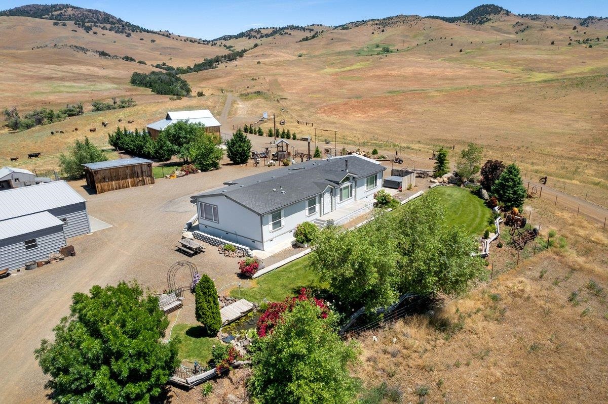 Welcome to the Circle Y Ranch in the foothills of Shasta Valley in Northern CA.  Country life awaits on this ranch-style home boasting an open floor plan & spacious rooms, vaulted ceilings with a fully landscaped yard!   This home has been lovingly maintained & customized to suit the country lifestyle. Enjoy central heat/ac and Blaze King wood stove comfort in an amazing setting overlooking the Shasta Valley!  This 266 acre property is primarily spring grazing land w/ a seasonal creek and fenced/cross-fenced pastures for livestock.  New well drilled in 2022 & water piped to multiple stock areas.  Surrounded by open range and ranches, this property is set up for relaxation and enjoyment with a two car garage & separate shop, above ground pool with decking and a vintage barn that's been restored to a family event venue! Willow Creek Elementary School is down the road and just 18 miles to Yreka, CA for shopping & services.  Too many more amenities to list- Schedule your private tour TODAY!  NOTE: The accuracy of the information provided is deemed reliable but is not guaranteed, is subject to change and should be independently verified.