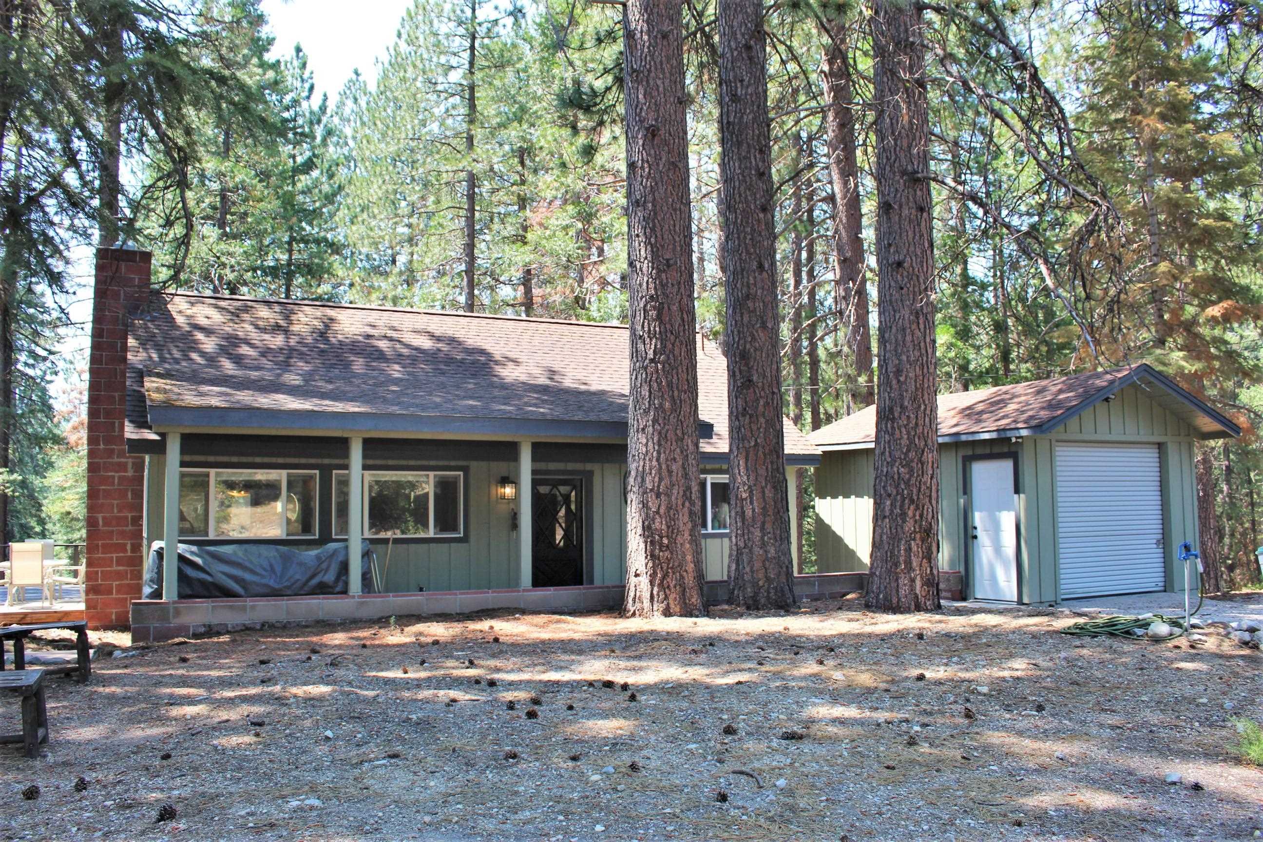 Opportunities Galore! 19 acre parcel zoned for Multi Family Residential Income General! Park like setting with multiple views of Mt Shasta and dreamy sunlight streaming through the pines to the many open areas for easy RV set ups. One house has been completely remodeled into a jewel box cabin in the woods. Pecky wood beamed cathedral ceilings, hardwood and tile floors, new windows, wood stove, tile bathroom and so much more! Covered porch entrance and large deck overlooking the conifers.  Large downstairs bedroom with doors onto large deck and upstairs loft bedroom. The 1150sf second home is waiting for your inspiration and cabin #1 shows what can be done! The previous owner planned an RV park and you can take it to the next level while creating your own full time business. Great well, hi speed internet and power with road access all into this property in multiple areas. Or if you are looking for a "retreat" property with multiple homes and meeting centers etc-this one qualifies with existing county zoning! Call today to come walk the property and be enchanted!