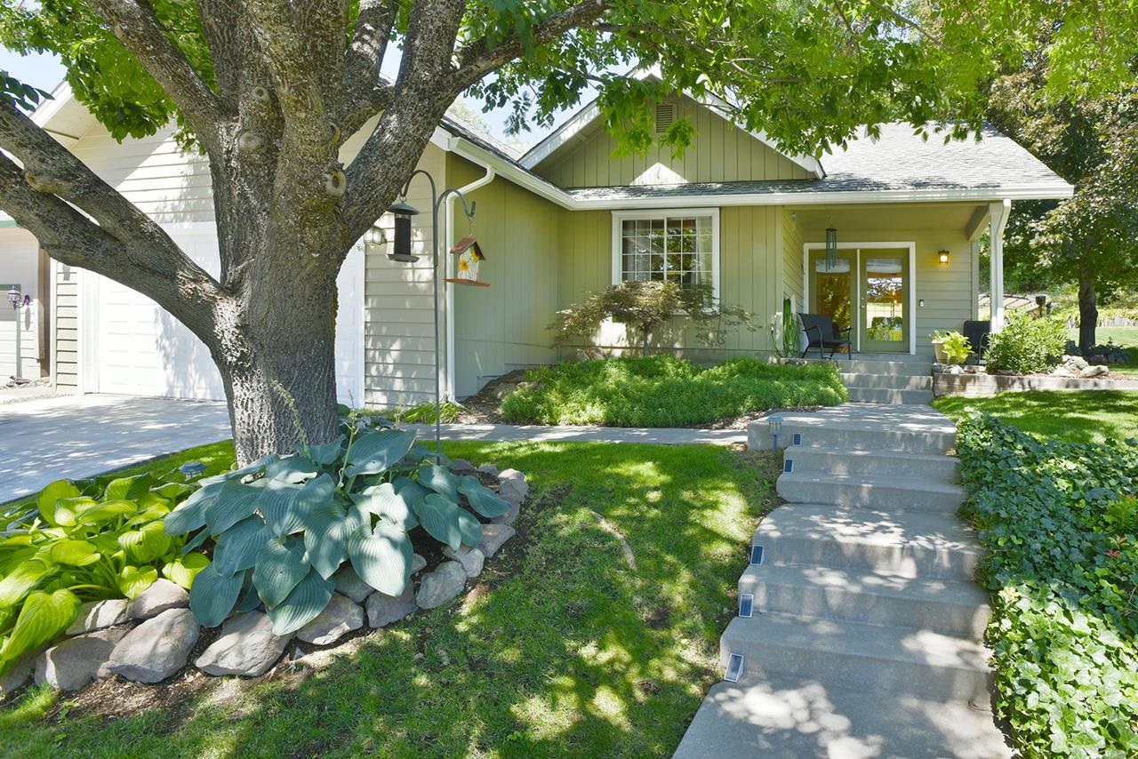 WELCOME TO 606 MEADOW AVE. in the highly-desirable neighborhood of Meadow Brook Estates, where inviting homes boast pride of ownership. Entering this dignified 3BR, 2BA home feels like a comforting embrace, with elegant details such as brand new carpet, vaulted ceilings, bullnose corners, and lovely arched grid windows. At appx. 1534 SF, this turnkey home offers just the right amount of space with an efficient floor plan offering Living Room, Dining Room, and Kitchen at the south side of the home, with 2nd BR, Main BA, and Primary BR with full en Suite at the north end. A small Front Den includes a staircase leading up to the 3rd BR, which doubles as an excellent Game Haven/Media Room for these empty nesters. The home sits on a delightfully landscaped 0.28 acre yard featuring front, side, and rear concrete patios, and a fire pit to maximize outdoor living enjoyment. Mature trees, shrubs, sweet peas galore, a verdant lawn, and designated garden area ensures plenty of creative puttering opportunities for the nature-loving Green Thumb. Contact your Realtor to schedule your showing today! NOTE: All sizes, measurements, square footage, and descriptions are approximate, Buyer to verify.