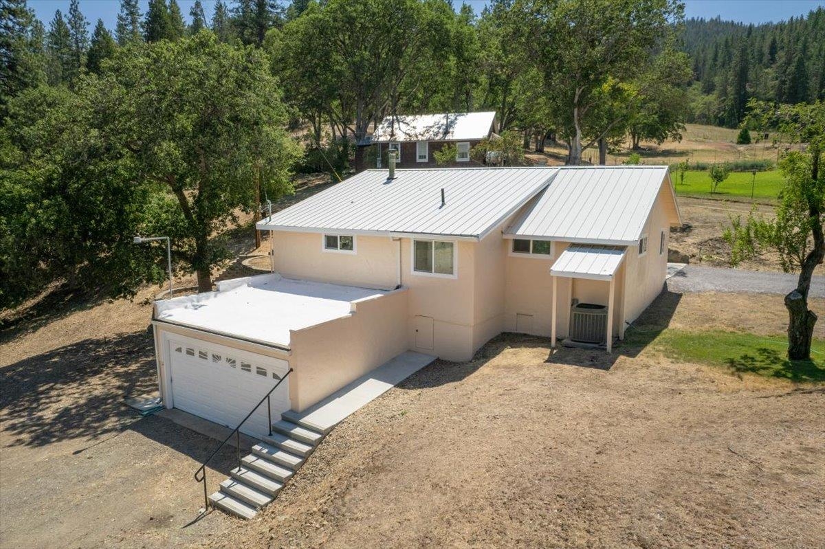 Amazing opportunity to own one of Yreka's original homesteads, owned by the same family since the early 1900's & now proudly offered for your consideration. Enjoy the peaceful setting on 80 acres with timber & rolling hills- now improved with 2 homes. Multiples springs w/ a spring fed water system that has proven itself over the decades w/ approx 7000 storage tank, park-like garden area with mature apple, pear, vines & perennials with pasture that once grazed cattle & horses. The lower 2 bed/1 bath home has recent updates of new exterior paint, granite kitchen counters, custom walnut cabinets w/ tile backsplash & flooring. Enjoy wood heat or central Heat/ac plus a vintage wood cooking stove that is both charming & completely functional! Upper home is a 2 bed/1 bath cabin-like home with so much potential & loft area! Ideal property for anyone that dreams of the outdoor, homestead life with underground power to the barn & workshop w/ greenhorn creek frontage. Country life including wild turkeys, quail & black-tail deer await at this rare find in the heart of gold mining history! Conveniently located just 2 miles from the town of Yreka- Schedule your showing today!