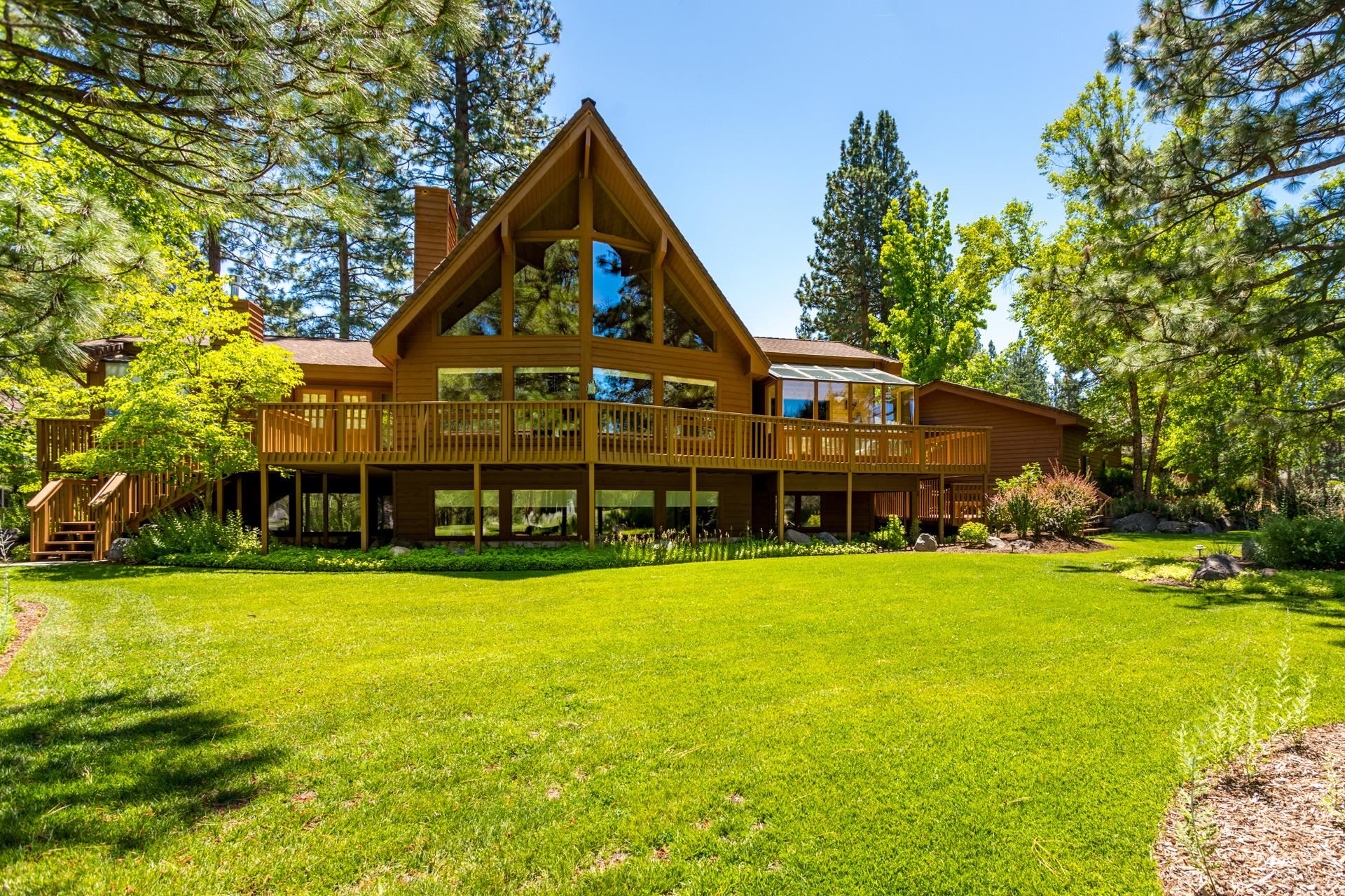 Experience the perfect blend of natural elegance, refined luxury and ultimate comfort in this stunning approximately 4480 sq.ft. Lindal Cedar home. Meticulously landscaped grounds welcome you to this tranquil retreat. Thoughtfully designed for function and entertaining, a soaring cedar lined ceiling and wall of windows in the living room open to the expansive view of the 5th fairway. The bright sunroom is perfect space to begin the day, after waking from one of two primary en suites. The lower level boasts a spectacular bonus room with private office, TV viewing area, gym, wine closet and so much more! If garage or shop space is what your heart desires, look no further. Offering 3 separate oversized fully finished garages, including a RV garage with 14 foot doors, 50 AMP service and your very own fish cleaning station. Two of the garages are equipped with bathrooms and pellet stoves. A plethora of space for RV's, boats, cars and storage! Located only a hour from the Oregon boarder, this hidden gem is just waiting to be discovered.