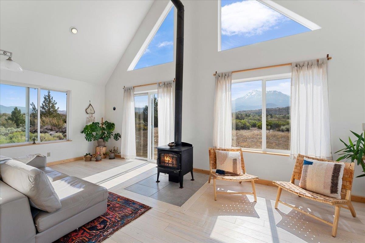 OFF-GRID, SELF-SUFFICIENT HOMESTEAD! Perfect for use as a retreat, organic farm, family compound, or horse property! Enjoy stunning, panoramic views of Mt Shasta, the Eddy’s, and everything in between, from this private 20-acre Juniper Valley sanctuary. The 1bd/1ba, 900 sq ft home features an open floor plan with unobstructed Mt Shasta views from the great room, loft, and deck that will take your breath away! The separate 250 sq ft studio with half bath will delight guests and the additional 500 sq ft workshop with attached 1-car garage could be used as an additional living space, yoga studio, office, art studio, and more. The studio and workshop each have their own wood stove, flagstone patio, and a gorgeous view of Mt Shasta! Other property features include 2 fenced garden areas with plum, apricot, & peach trees, grapevines, and raised beds; solar panels, wind turbine, Outback off-grid system, Cummins Onan 4500-Watt generator, shipping container, shed, water tank, and new well pump. If you’re looking for a serene getaway with plentiful space between neighbors & within easy driving distance to town amenities, SCHEDULE A PRIVATE TOUR OF THIS ONE-OF-KIND PROPERTY TODAY!