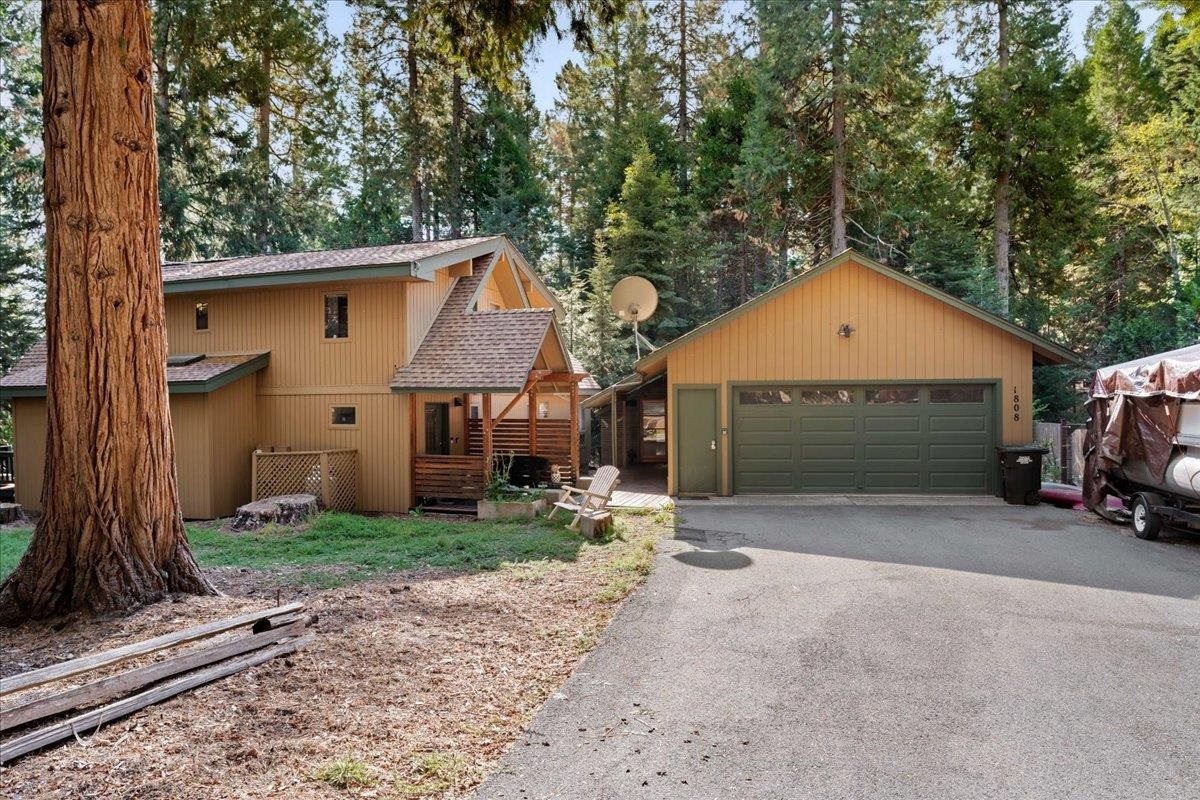 Beautiful country home on the outskirts of Mt. Shasta, sits this custom cedar home on 0.82 acres. Vaulted ceilings, picture windows, and sky lights give this unique home an open warm, natural light feeling.  The house sports 3 bedrooms 2 and 1/2 bath with the primary bedroom on the first floor. Laundry room is located off the kitchen.  Kitchen has tile flooring, custom cabinets, island with range, stainless steel appliances that open to the very bright living room. Other features include forced air heat and A/C with a wood stove,  a beautiful deck out the sliding glass door that leads you to a very private setting. The 2-car garage offers an extra bonus room off the back deck and opens to an amazing back yard with a seasonal creek, lots of trees and privacy for your outdoor entertaining.