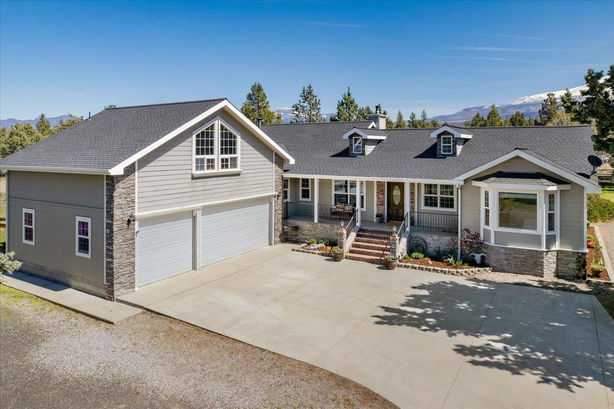 LUXURY MEETS COUNTRY in Weed, CA. Enjoy 12+ acres in this meticulously maintained 3118 sq ft, 4BD/4BA custom home.   From the welcoming covered front porch to a sprawling deck in back, this home has been lovingly updated and maintained- THE PRIDE OF OWNERSHIP SHOWS! Enjoy 2 primary suites, open living spaces with vaulted ceilings, artistic stone hearth and tons of natural light & AMAZING MT VIEWS!  Fully renovated & updated including appliances, Boch central heating/air (2020) w/ a luxurious primary ensuite with custom tiled bathroom.  A private studio w/ kitchenette & bath above the 3-car garage, 43 X 40 barn w/ roll-up door & turnouts, cross-fencing w/ garden areas & detached garage/workshop completing the country charm! This home offers comfort and convenience! Located on outskirts of Lake Shastina & golf recreation- Don't miss your opportunity to own this home!