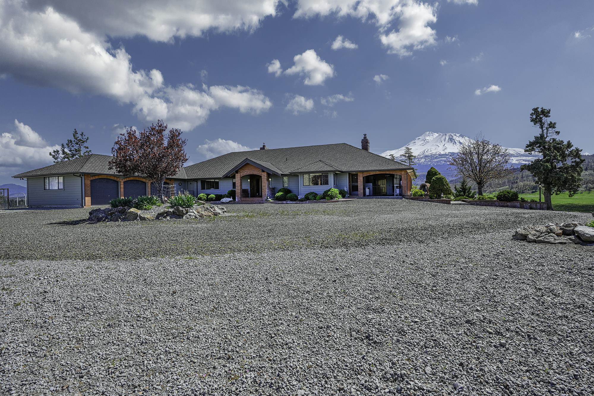 Discover the rare blend of privacy, space, and versatility at Shasta O Ranch. Property consists of 4 parcels totaling over 1300 acres. Access from homes and property from both Jackson Ranch Rd and Ordway Rd. The main residence set on an expansive 250-acre lot with a home over 4200 sq ft. This inviting home features 3 spacious bedrooms, 3.5 thoughtfully designed bathrooms, a welcoming entryway, and a formal dining room for memorable gatherings. Enjoy the sun-filled conservatory, breezeway connecting spaces, breakfast nook for casual mornings, a dedicated guest quarters for overnight visitors in the downstairs area. The 3-car garage provides ample storage for vehicles and hobbies. The guest house is aprox. 1500 sq ft with 3 beds/ 3 baths. Farmhouse is 1780 sq ft with 3 beds/ 2baths. Each home has it's own well and septic. Multiple ponds, barns, shops, corrals, and fencing. Imagine life surrounded by nature, yet close to town amenities. Don’t miss your chance—schedule a private tour or contact the agent today to secure your personal retreat.