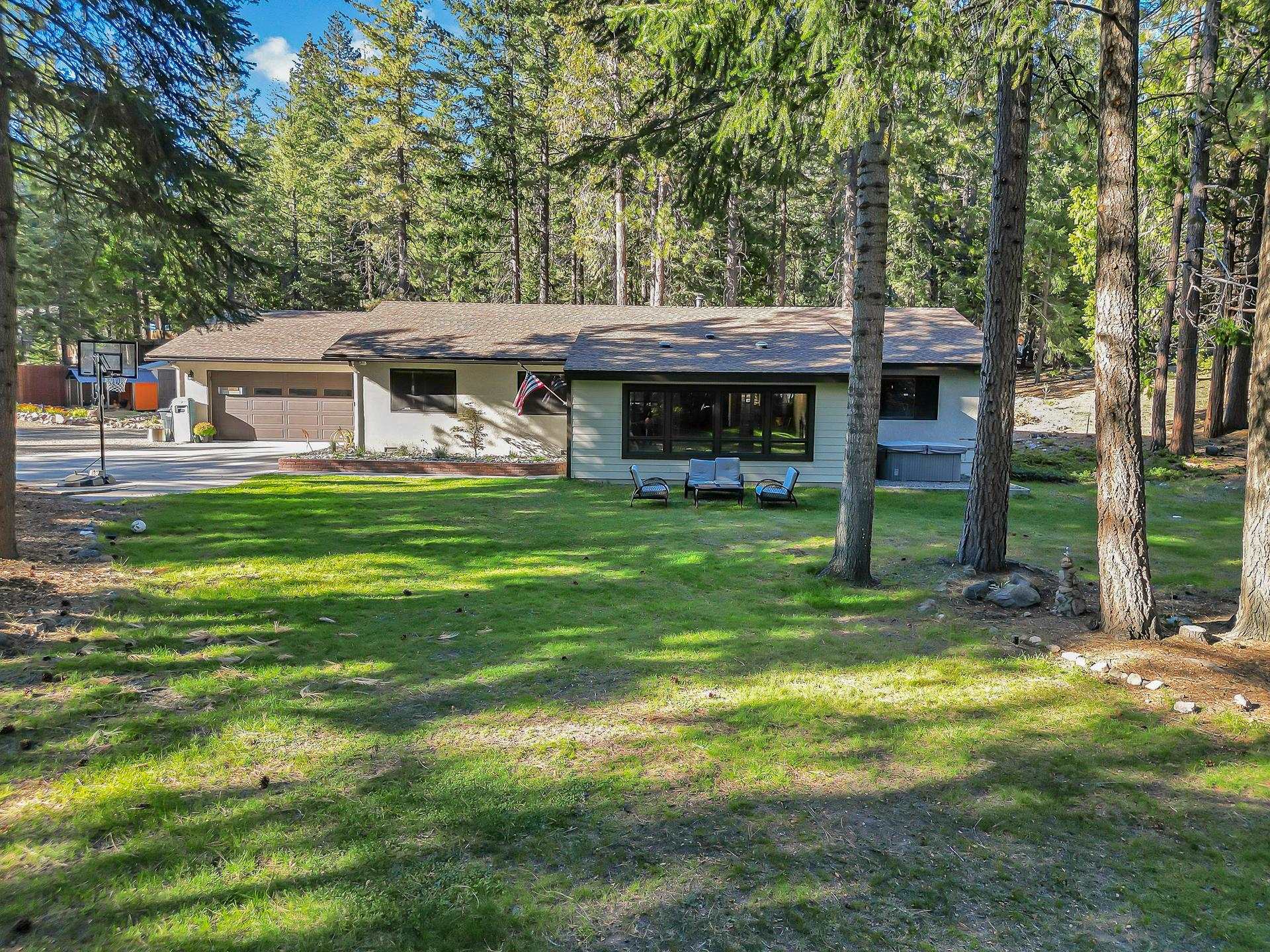 Welcome to 208 Pony Trail in Mt. Shasta, CA! This 1,951 sq. ft. home sits on 1.5 private acres with mature trees and a sweeping lawn, offering the perfect blend of privacy and natural beauty. Step inside to soaring vaulted ceilings and a bright sunroom where oversized windows flood the space with natural light. The updated kitchen is a true highlight, featuring leathered granite countertops and new appliances, while the bathrooms have also been tasteful modern finishes. Three spacious bedrooms and two versatile bonus rooms off the garage provide endless options—ideal for a home office, gym, studio, or creative space. Outdoors, you’ll enjoy a peaceful setting under the shade of towering trees, with plenty of room to relax, entertain, or simply take in the mountain air. The private setting adds to the sense of seclusion, all while being just minutes from downtown Mt. Shasta, pristine lakes, and miles of hiking and biking trails.Whether you’re searching for a year-round residence, a weekend retreat, or a home designed for entertaining, 208 Pony Trail delivers comfort, privacy, and the best of Mt. Shasta living. Schedule your private tour today and experience it for yourself!