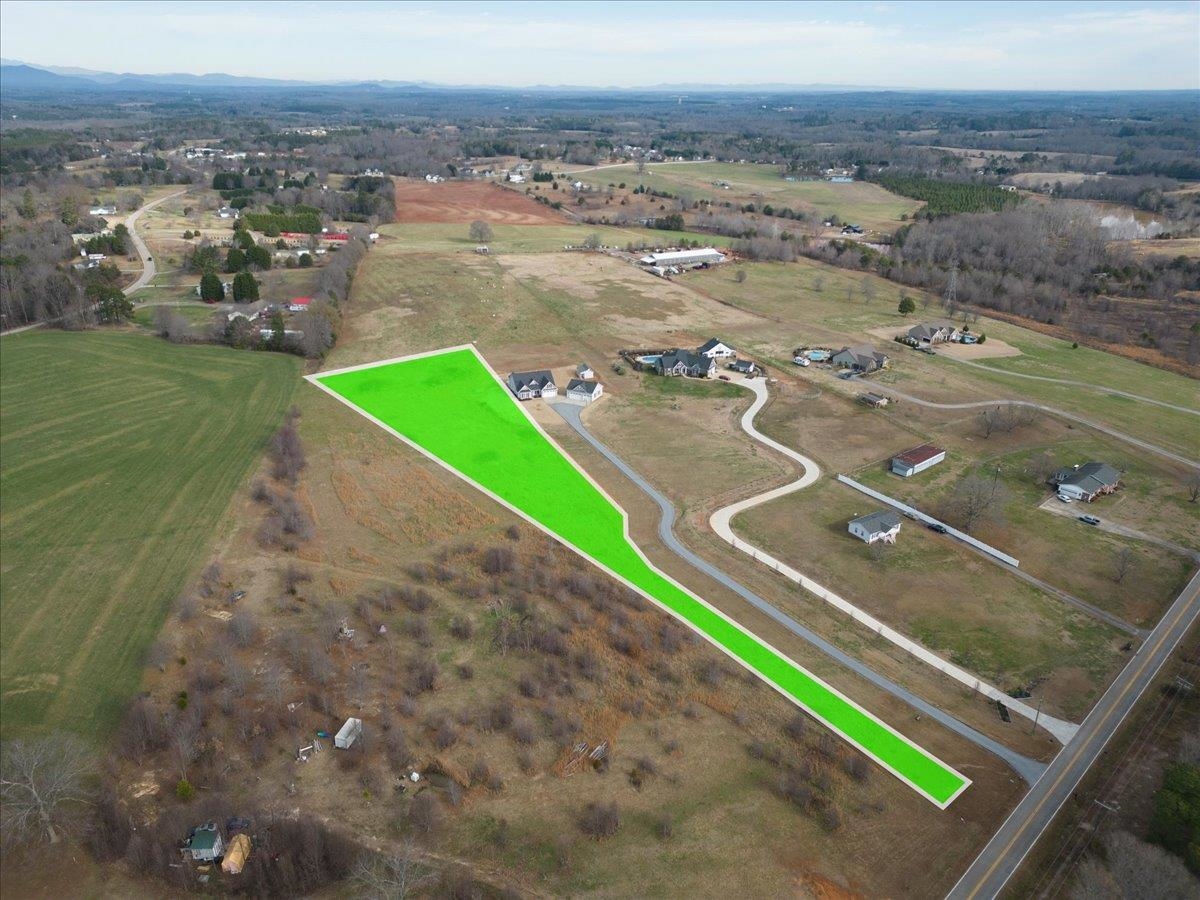 BEAUTIFUL 2.5 Acres in Inman/Campobello area! Non-Restricted! Mountain Views. Future homesite sits about 600 - 700 feet off the road, where the lot opens up to breathtaking views of pasture, mountains and rolling hills (in all directions)! Right around the corner from Holston Creek Park!  Subject property is currently PART OF a larger parcel, tax map 1-37-00-090.25. Owner is in process of surveying off the approximate 2.5 acres being sold.