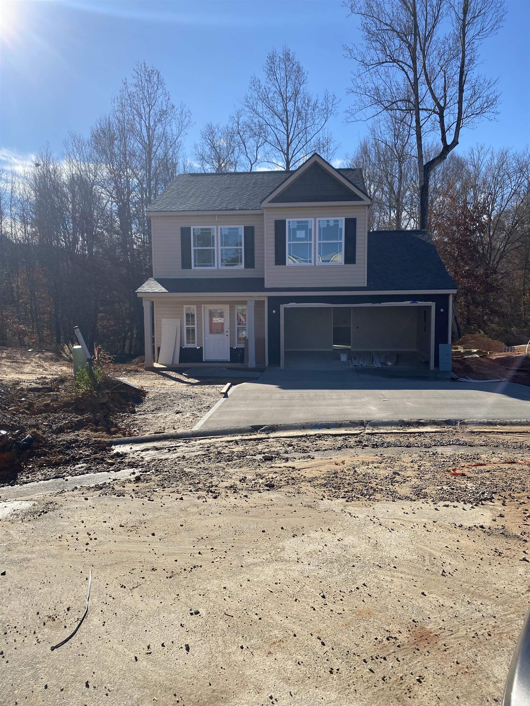 This 2 story Reynolds plan has over 1500 SF of heated space with 3 bedrooms and 2 full baths upstairs. Living area and kitchen on the first floor with a powder room. Home features granite countertops, Marsh Cabinetry, lots of crown molding and trim. All stainless appliances to include: dishwasher, range and microwave.  Step out onto the 12' x 12' covered patio with another 10' x 12' uncovered patio (perfect for grilling and entertaining). This home backs out to the woods and only one neighbor directly beside you. Come see what Timberwood has to offer today! Ask about our builder incentives!