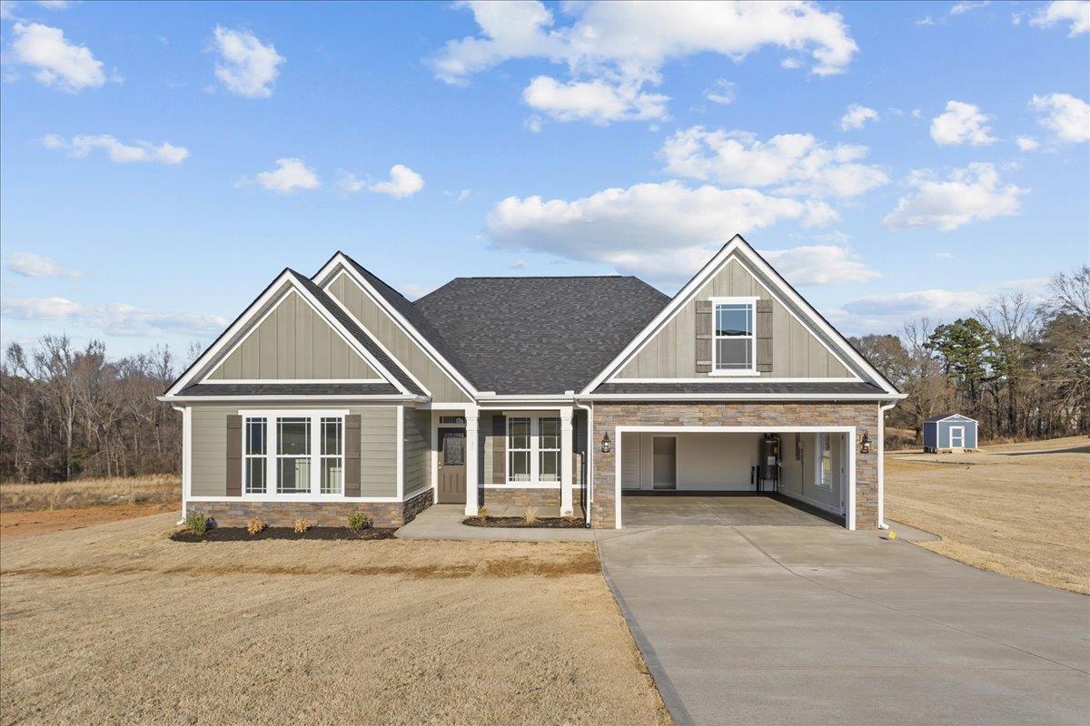 Welcome to your dream home! This beautiful new construction on a large 1 acre lot, is situated in the picturesque town of Inman, South Carolina, offering breathtaking mountain views that will leave you in awe.   Step inside and you're greeted by a spacious entryway with trey ceiling that leads into a large living space with gas fireplace. You'll love the bright and inviting sunroom, perfect for enjoying your morning coffee or relaxing with a book. The open floor plan seamlessly flows into the gourmet kitchen, featuring stunning granite countertops and stainless steel appliances. The cement board siding adds durability and low maintenance to your home.  The luxurious master suite is a true oasis, featuring a fully tiled shower with dual showerheads, making every morning feel like a trip to the spa. The additional bedrooms are generously sized and offer ample closet space.  This home boasts impeccable attention to detail and craftsmanship, ensuring quality and longevity for years to come. Don't miss the opportunity to call this stunning home yours and enjoy the peacefulness and serenity that Inman has to offer. Schedule your private showing today!