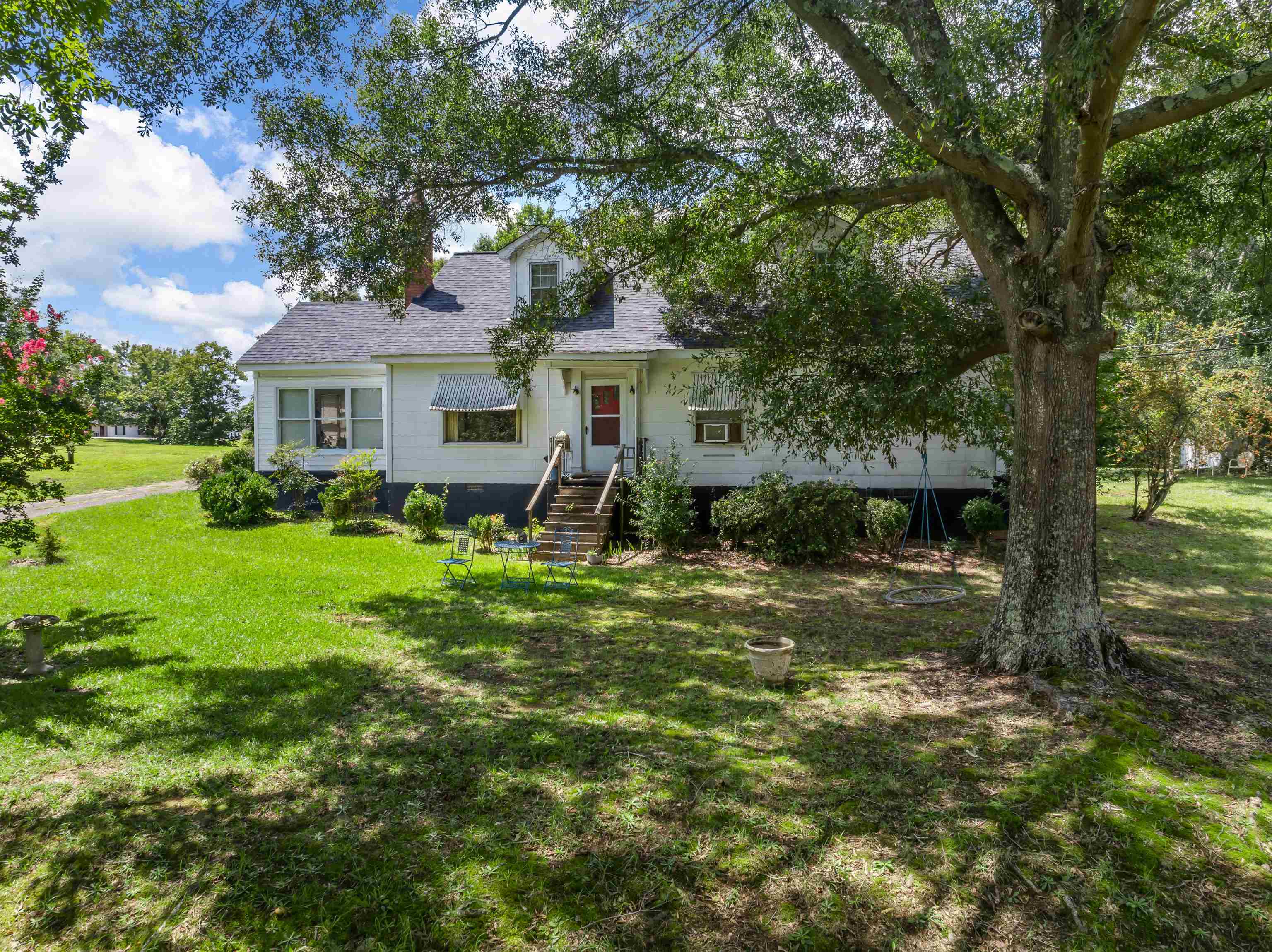Welcome to 1741 Rainbow Lake Road! This exceptional 5-acre parcel presents a fantastic opportunity for commercial development or a spacious homestead. The property features an expansive 2,744 square foot home with 4 bedrooms and 3 bathrooms. After some cosmetic renovations there would be plenty of space for friends and family to gather and create lasting memories. Imagine creating a beautiful farmhouse for homesteading.  You can enjoy the convenience of location while enjoying serene country living. Convenience is key, and this location excels with easy access to essential amenities. It's just 5 minutes to the new Target, Publix, and Walmart in Boiling Springs. Additionally, the property is situated within the highly regarded District 2 school zone, offering an excellent education and a supportive community for making new friends. The adjacent property is also listed and if purchasing both then you would have over 6 acres. The property boasts road frontage on both Rainbow Lake Road and Riveroak Road, providing flexibility and ease of access. Whether you're envisioning a residential development or a private retreat, this location offers the versatility and potential to bring your dreams to life. House is being sold as is.