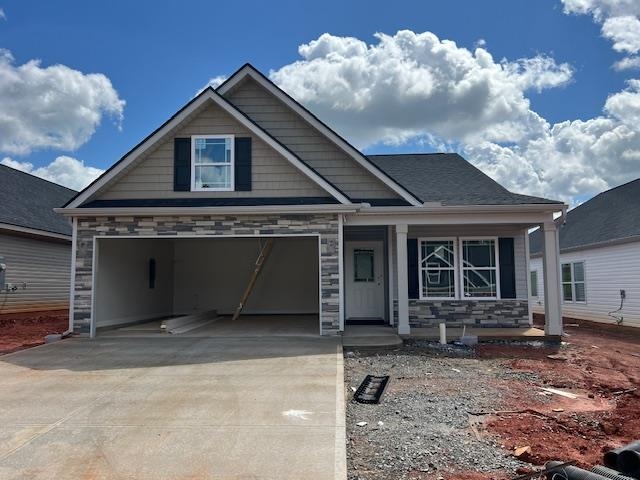 The BISHOP plan (Lot 65) has a spacious open living area and study. Granite countertops, crown molding with rope lighting, and many more features included. Master bath upgrade to include double vanity and garden tub in addition to walk-in shower.  12' X 12' Covered patio and additional 10' x 12' uncovered patio overlooks the private yard.  Craftsman Siding Upgrade Package.  30-year architectural shingles, site-built construction, and a 10 year limited warranty are included to give you peace of mind.  Closing cost or upgrades incentives available when working with a preferred lender and attorney!!   *Virtual tour reflects same house plan, not exact house.