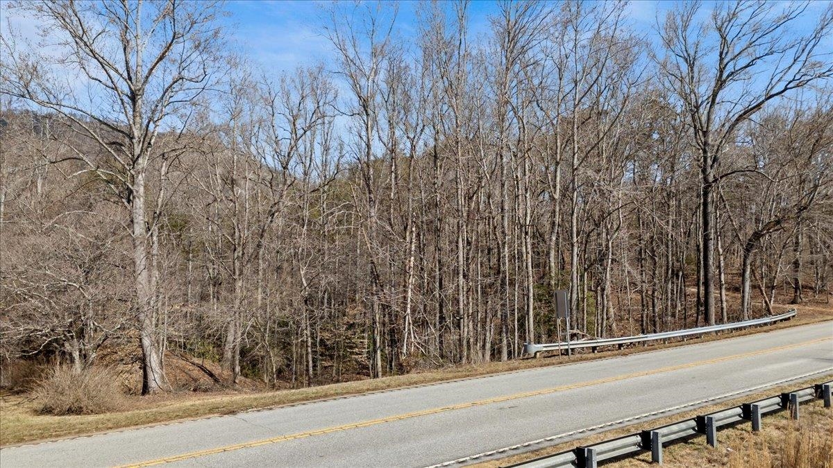 Greenville County schools: Tigerville Elementary, Blue Ridge Middle, and Blue Ridge High School. Additionally, there's an easement on the property allowing access to an adjacent lot, and it's important to avoid driving onto neighboring property.    Highway 11, Landrum, SC 29356: A 3.24-acre lot with gentle slopes and mature trees, located in the Glassy Mountain Township area. This property is conveniently situated near North Greenville College and is listed with no known restrictions. Property is located across the street from the Glassy Mountain Fire Department 2015 SC-11 Landrum, SC