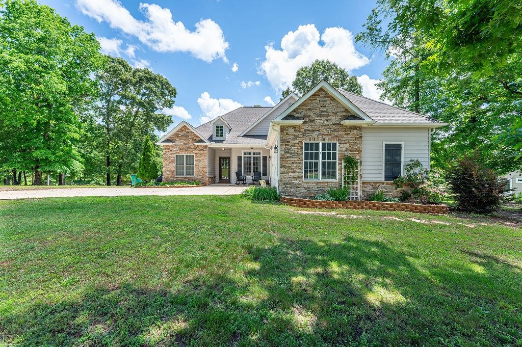 Gorgeous well-maintained home with a water view in the highly sought after Cane Creek community!! The spacious living area features vaulted ceilings, a gas fireplace, and beautiful wood floors. The deluxe kitchen contains built-in appliances and a very large pantry. In addition to the formal dining space, there is an eat-in breakfast nook. The master suite includes a tray ceiling, dual closets, and a huge spa-like bathroom with a tile shower and relaxing tub. The second bedroom is very large (combining bedrooms 2 and 3 from the original plan). Out back is an impressive covered deck overlooking the water and fire pit, perfect for the backyard lover. The over-sized garage is ideal for storage, tinkering, or just hanging out. The community amenity area has a playground and picnic area for you and your guests. Schedule a tour today!