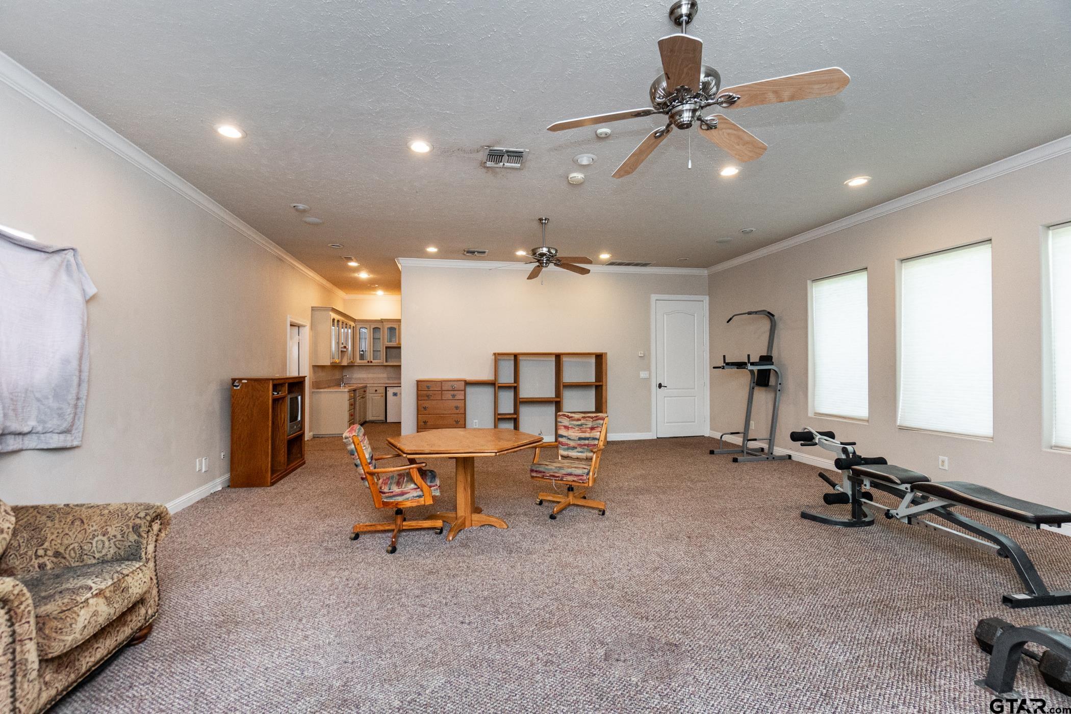 2nd floor includes family room/game room, bedroom, kitchen, full bathroom & attic access.
