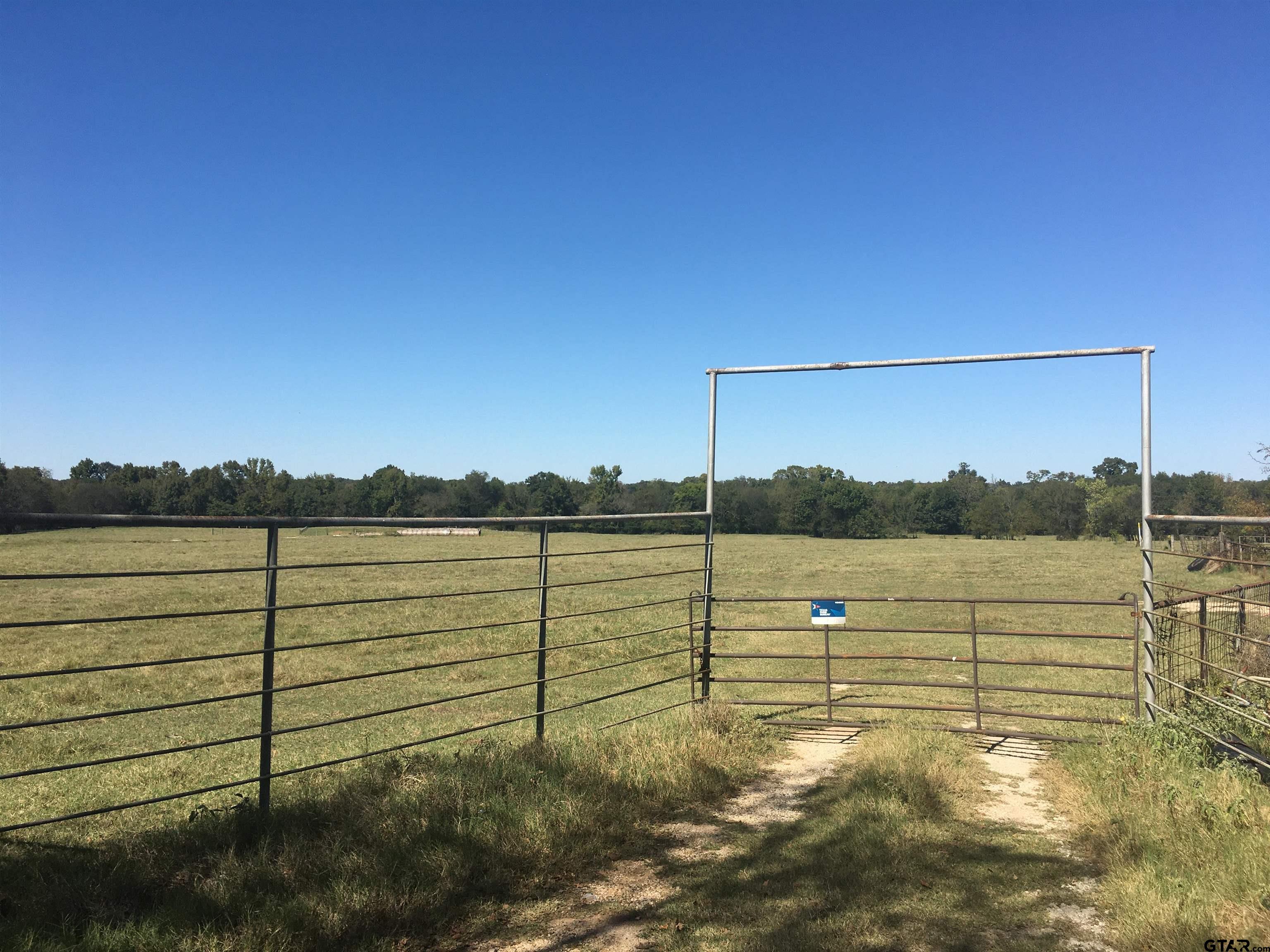 80+- acres on CR 2025 Currently used for cattle, hay production, hunting, fishing, recreation.