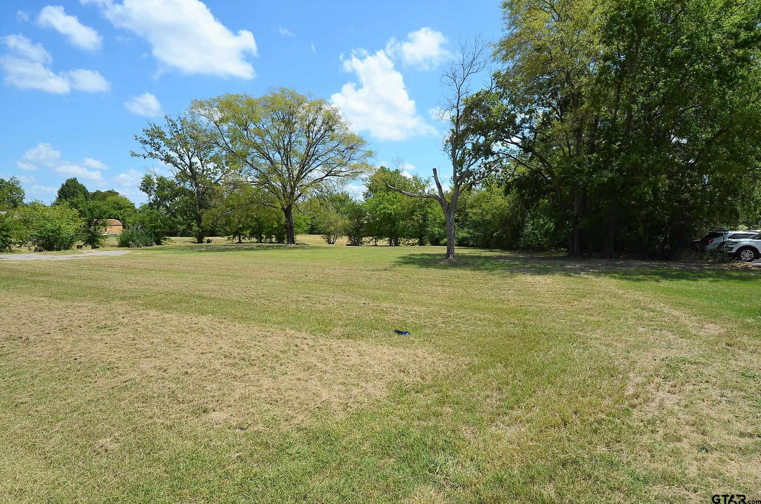 Spacious 1.8+ acre lot with development potential.