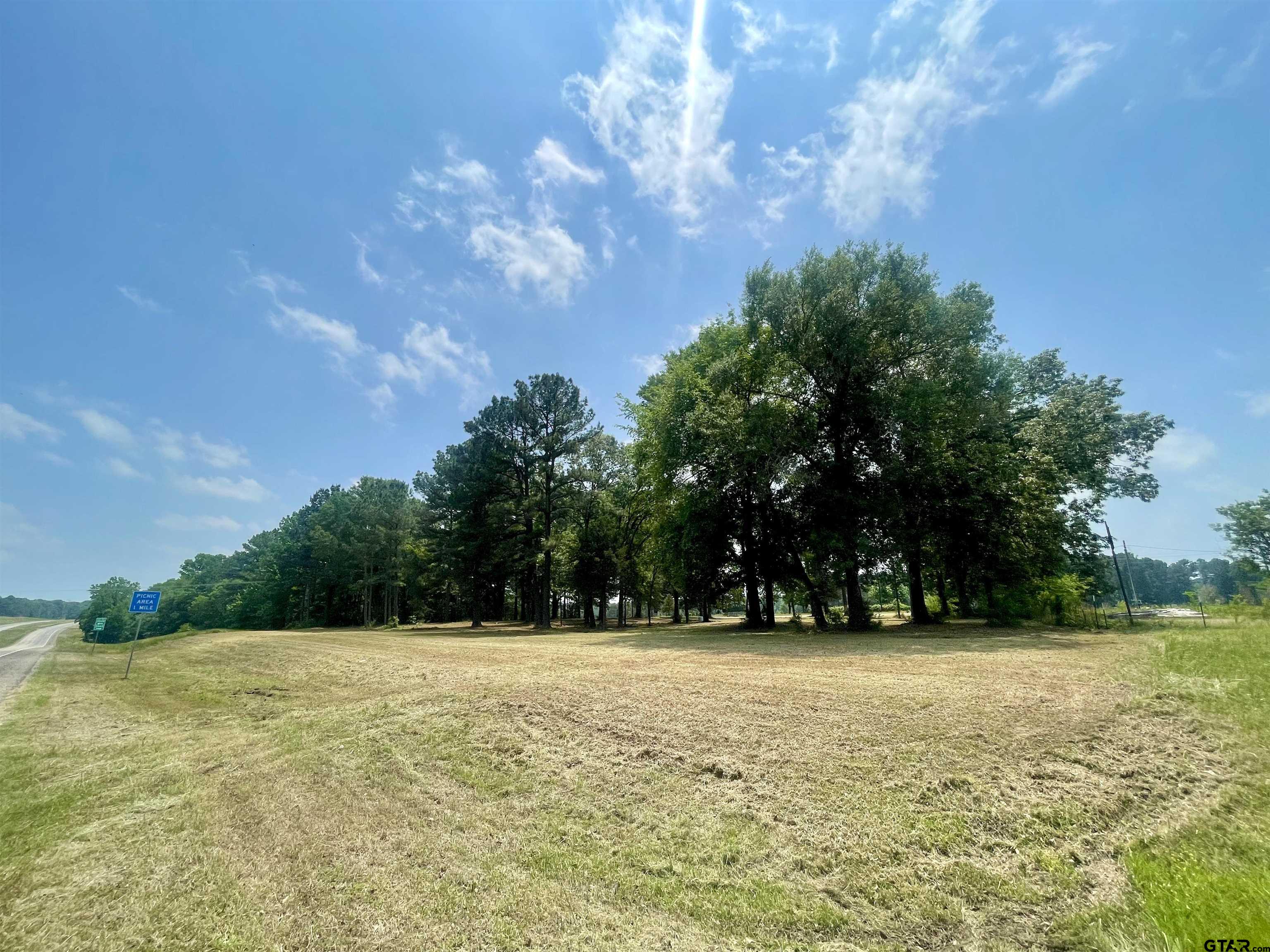 Come build your dream house on this 1.6 acre tract right off of HWY 80 and only 2.5 miles away from Hawkins ISD! Unrestricted land with road access to CR 3340 and HWY 80. Property is fully set up already with Electric and Water meter.  These are costly expenses already set up and ready for a new property owner. The location is perfect for a little bit of acreage outside of town. Mature hard woods throughout the property offer the perfect amount of privacy and shade needed. Call for your private showing today!