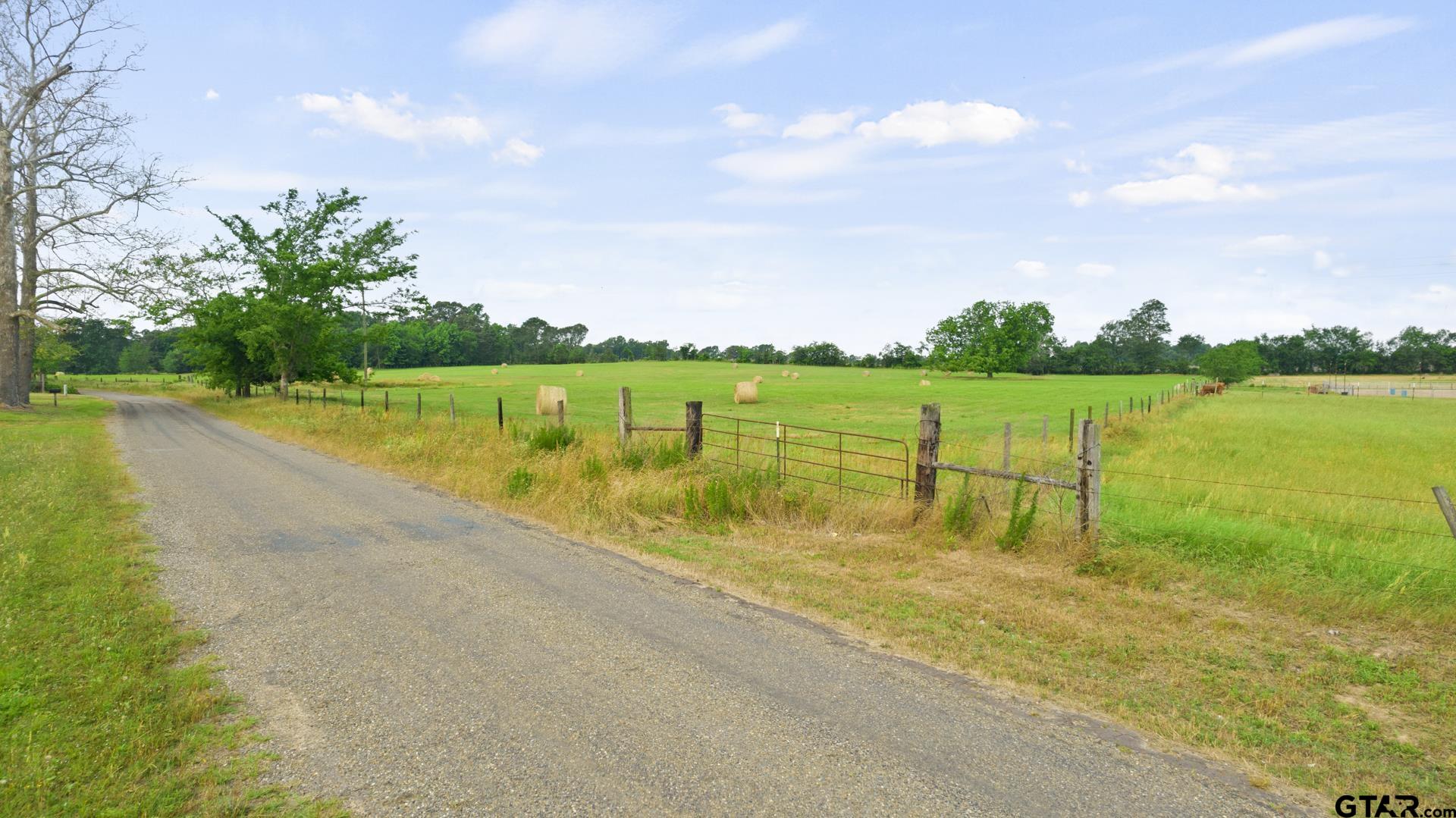 Looking for a wonderful homesite?  This rolling meadow has a beautiful hilltop view. small pond and completely fenced with 2 gated entries.  Currently used for hay production.  Not too far of the main road.  Beautiful Property.