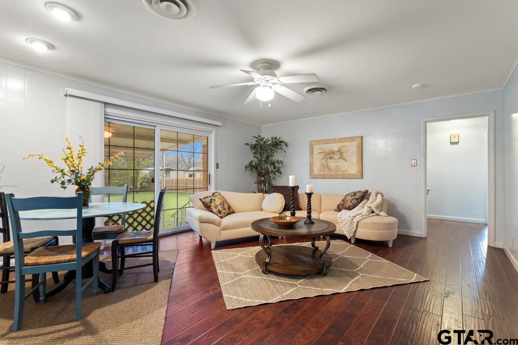 Has sliding door to back yard.  Room is adjacent to kitchen and living rooms.