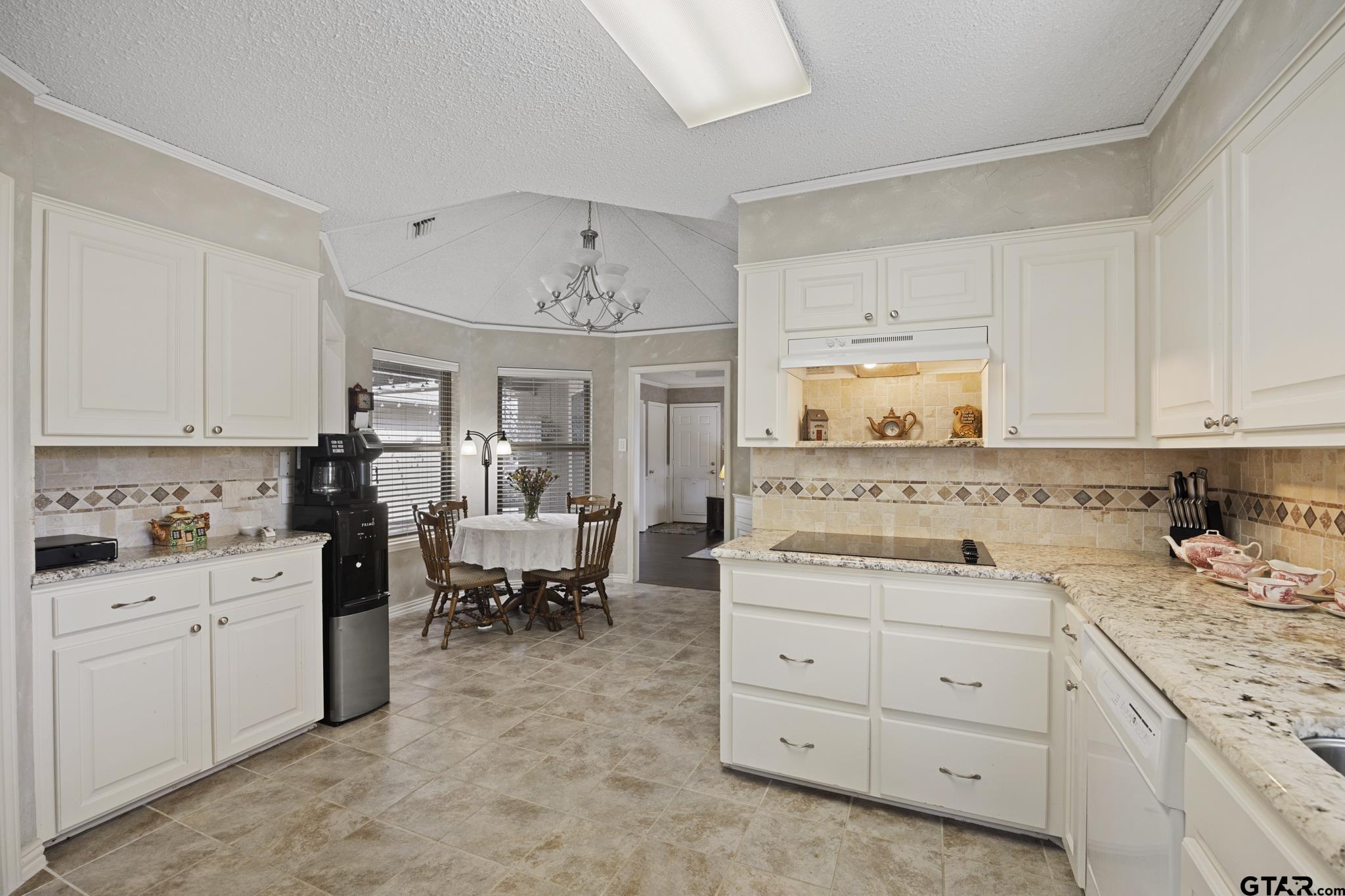 Kitchen features granite, new electric cooktop, dishwasher, microwave, pantry. Fridge is negotiable