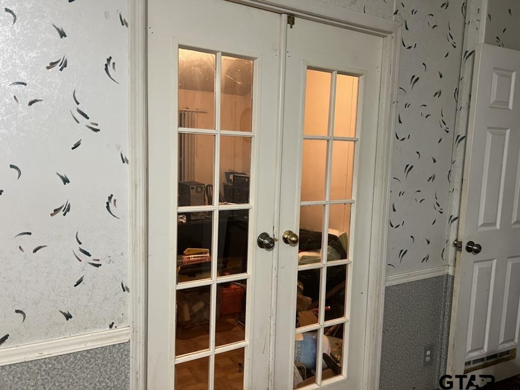 French doors off of the primary bedroom create great office/flex/nursery area.