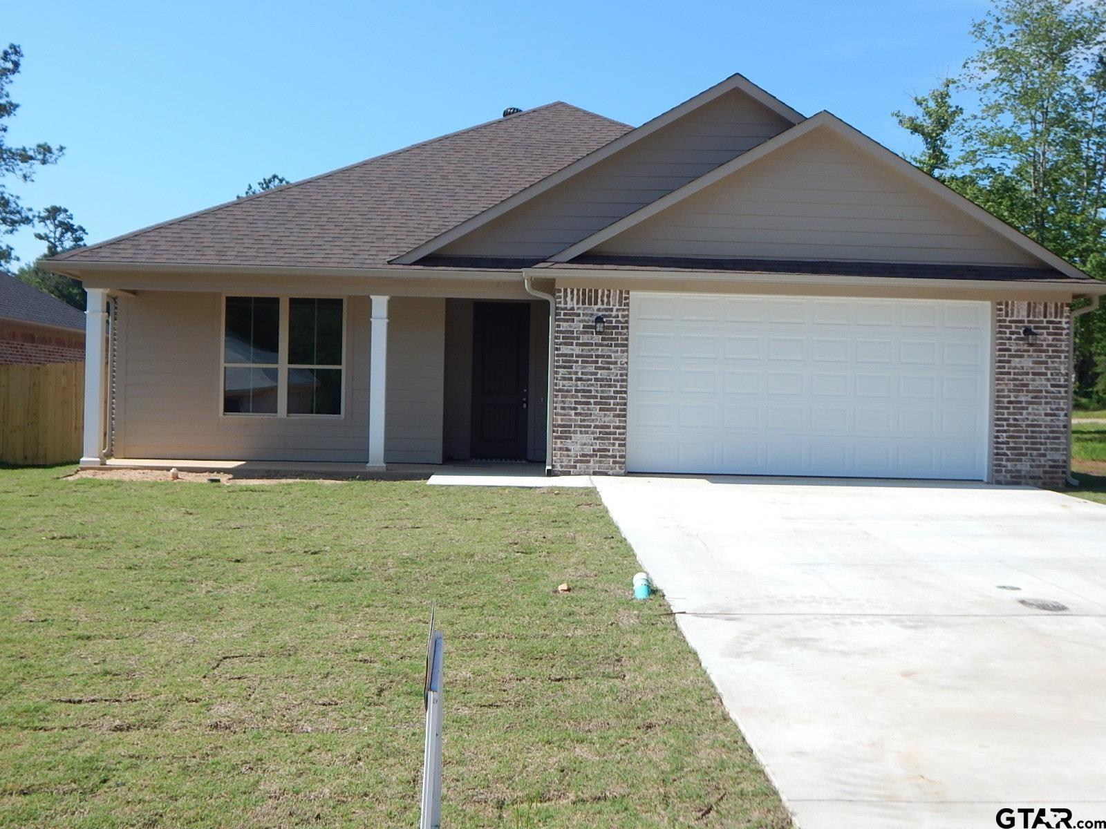 New energy efficient 3 bed, 2 bath NEW CONSTRUCTION brick house in Gilmer, TX. Very nice new house in new subdivision, 1,731 sq. ft, brick and siding, landscaped, with 6' privacy fence, big back yard, two car garage, curbs and gutters, concrete driveway, Lg. hot water heater, granite counter tops, Side by Side Refrigerator included, custom cabinets, light fixtures and more. Plenty of storage with huge pantry, covered patio in back, great floorplan, Vinyl plank in common, tile and carpet in bedrooms Come make this IECC Energy Efficiency Certified house yours before its gone.