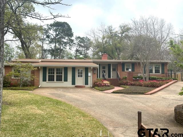 Enjoy the professional landscaping at a favorite photo stop on the Azalea trail and create your own private park in the huge backyard of this almost one-acre lot.  This updated split-level home has 3 bedrooms, 2 ½ bathrooms, formal dining room, kitchen and two living areas upstairs.  The flex space downstairs is the perfect work-from-home layout with its separate entrance or can serve as a third living area, play area or even a guest or mother-in-law space with its additional bathroom and dressing area with heated floors. The updated kitchen has a huge island with lots of storage and Viking Professional appliances.  There are hardwood floors and custom touches throughout the house, and the luxurious primary bathroom boasts heated floors.  A wonderful place to raise your family or enjoy your retirement