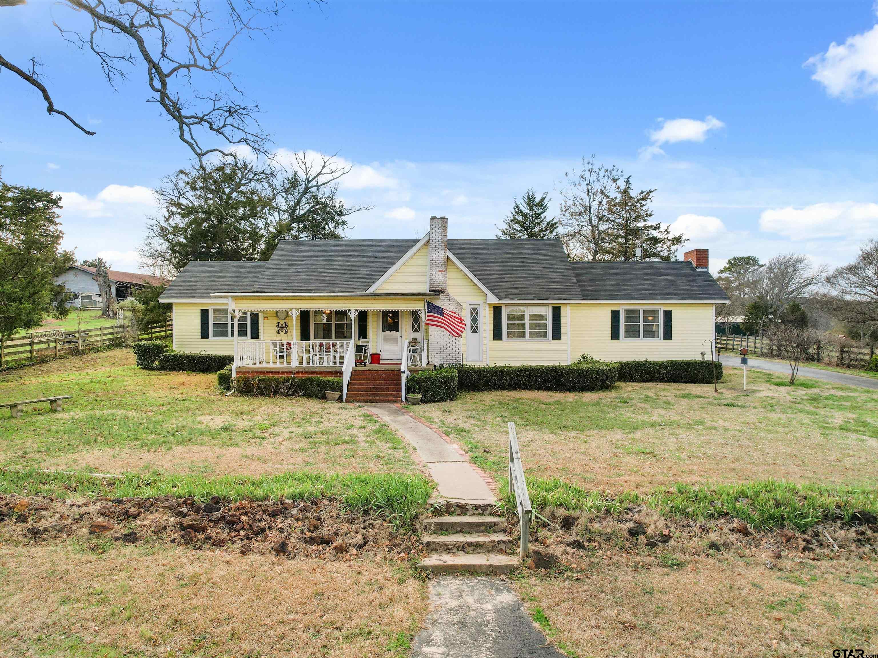 This is the farm house you've been seeing in your dreams! Truly a one of a kind home with so much history. Situated nicely on 4+- acres this 3 bed 2 bath home is just under 2,000 sqft and located just a couple minutes from town. Surrounded by well maintained acreage, across the street you will see gorgeous rolling hills and a pond. As you enter the home from the spacious front porch, you are greeted with a formal living space complete with a fireplace followed by a formal dining area. From there you'll flow into the kitchen area with a breakfast nook that has the most amazing views and an abundance of natural light. Off the kitchen you will find a spacious family room/ den with a large brick fireplace ideal for those cold winter days. This home has a lot more to offer, from a large screened in patio, large master closet/ storage room, its own water well, existing garden set up with timed sprinklers , also a barn for all your storage needs! Come and take a look at this home you are sure to fall in love.